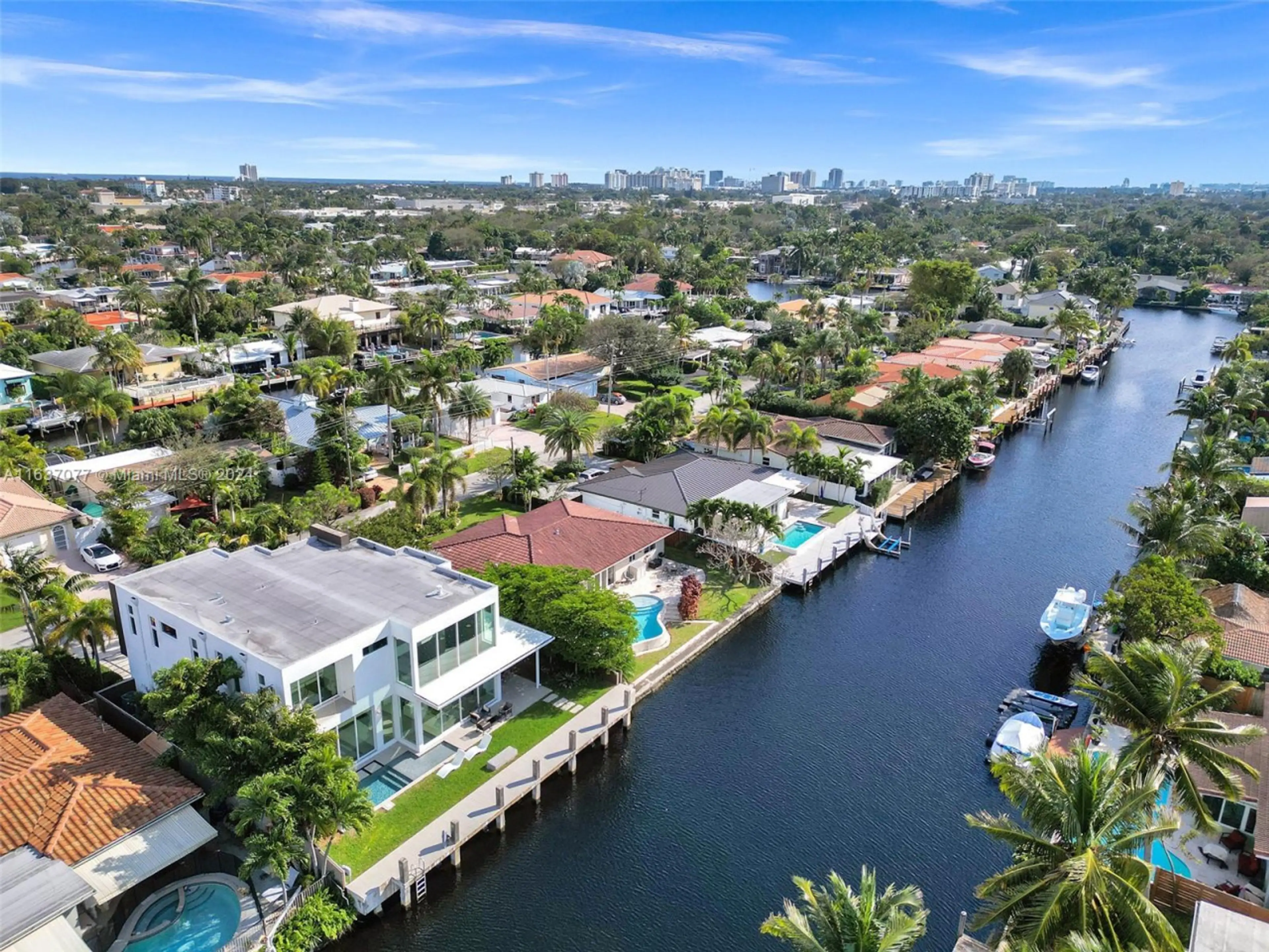 Refined canal front estate combining luxury living with premium water access and thoughtfully designed tropical landscaping
