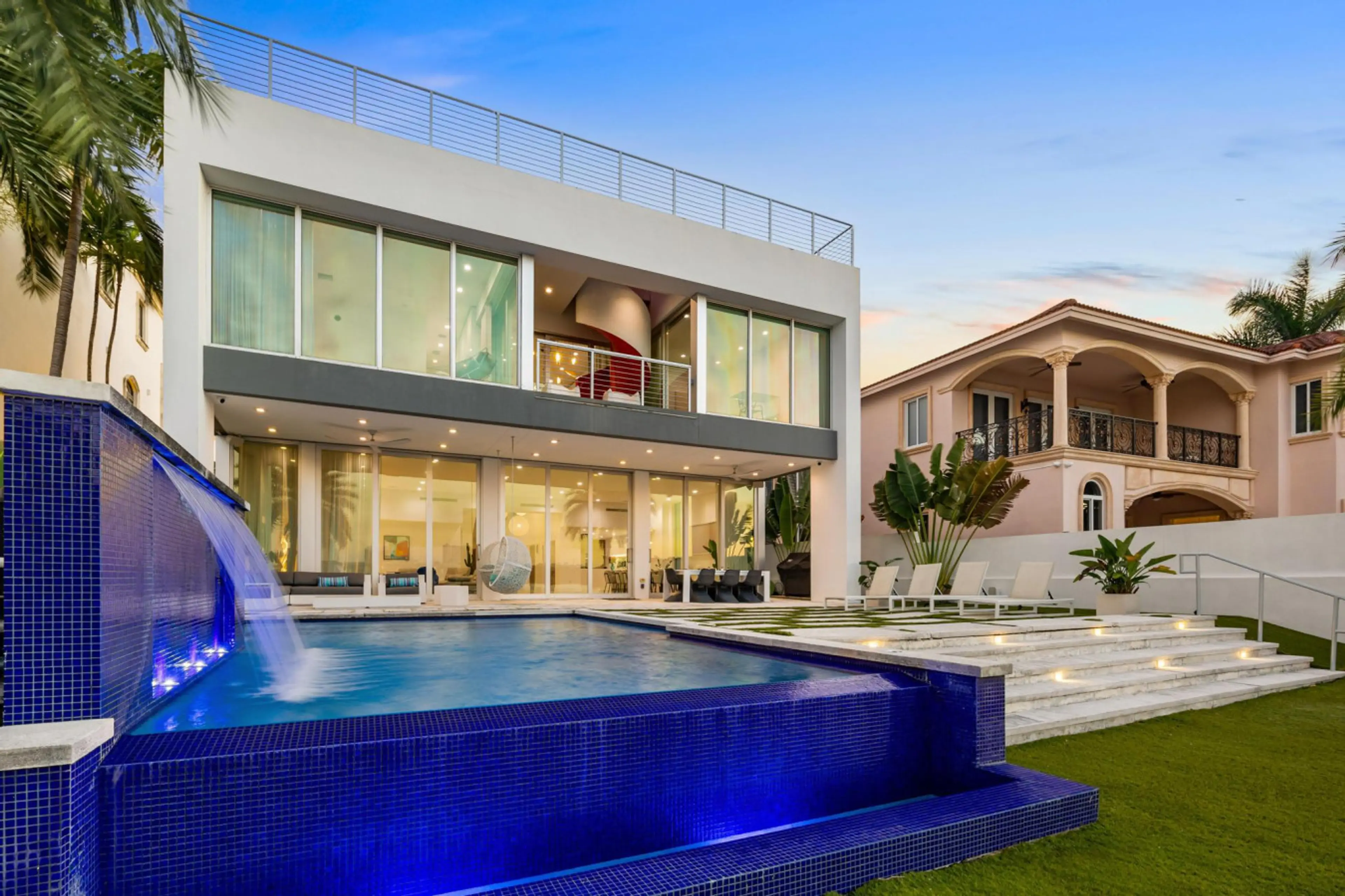 Architectural masterpiece featuring glass walls and infinity pool