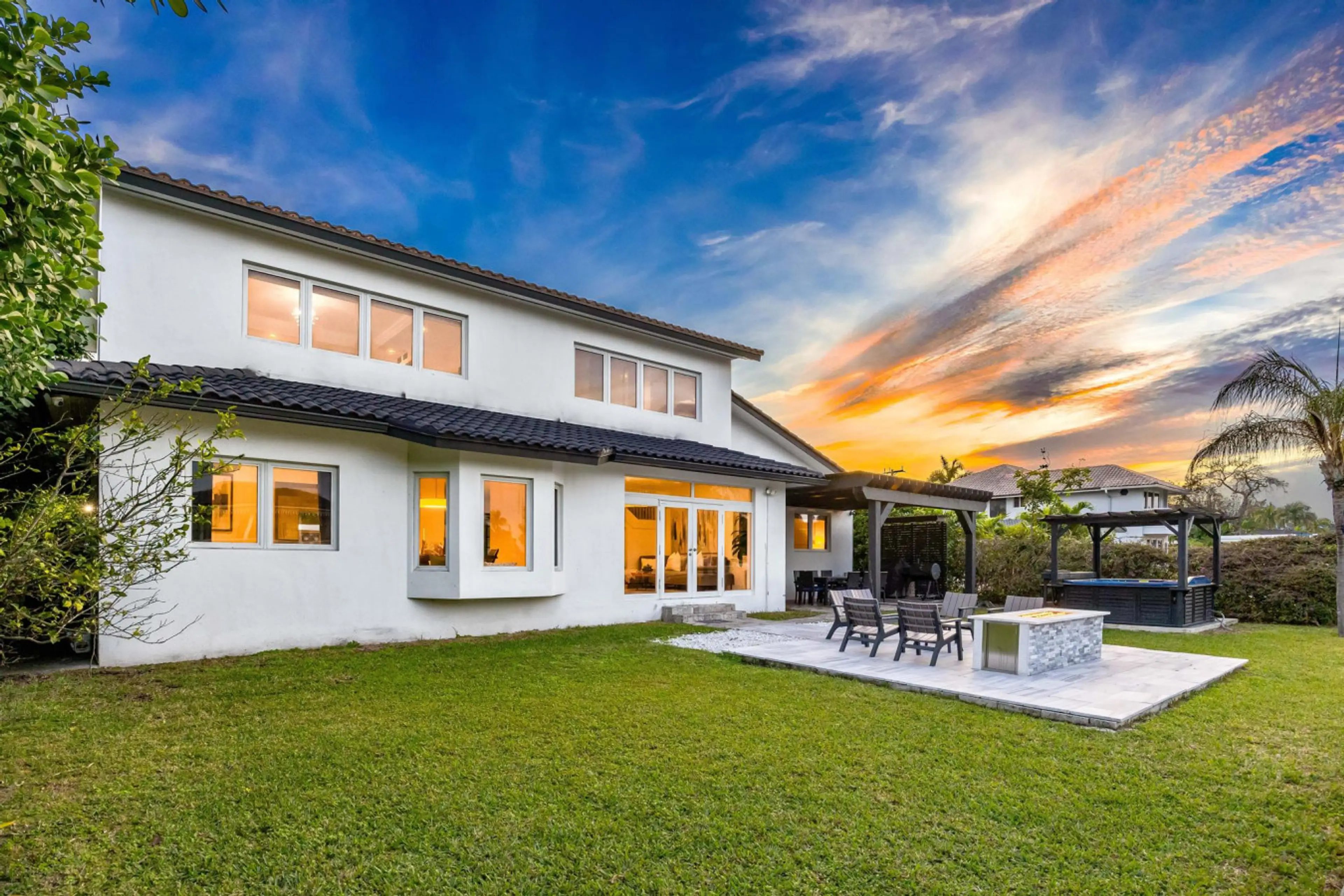 Modern architectural masterpiece with pristine pool area and magnificent twilight garden views