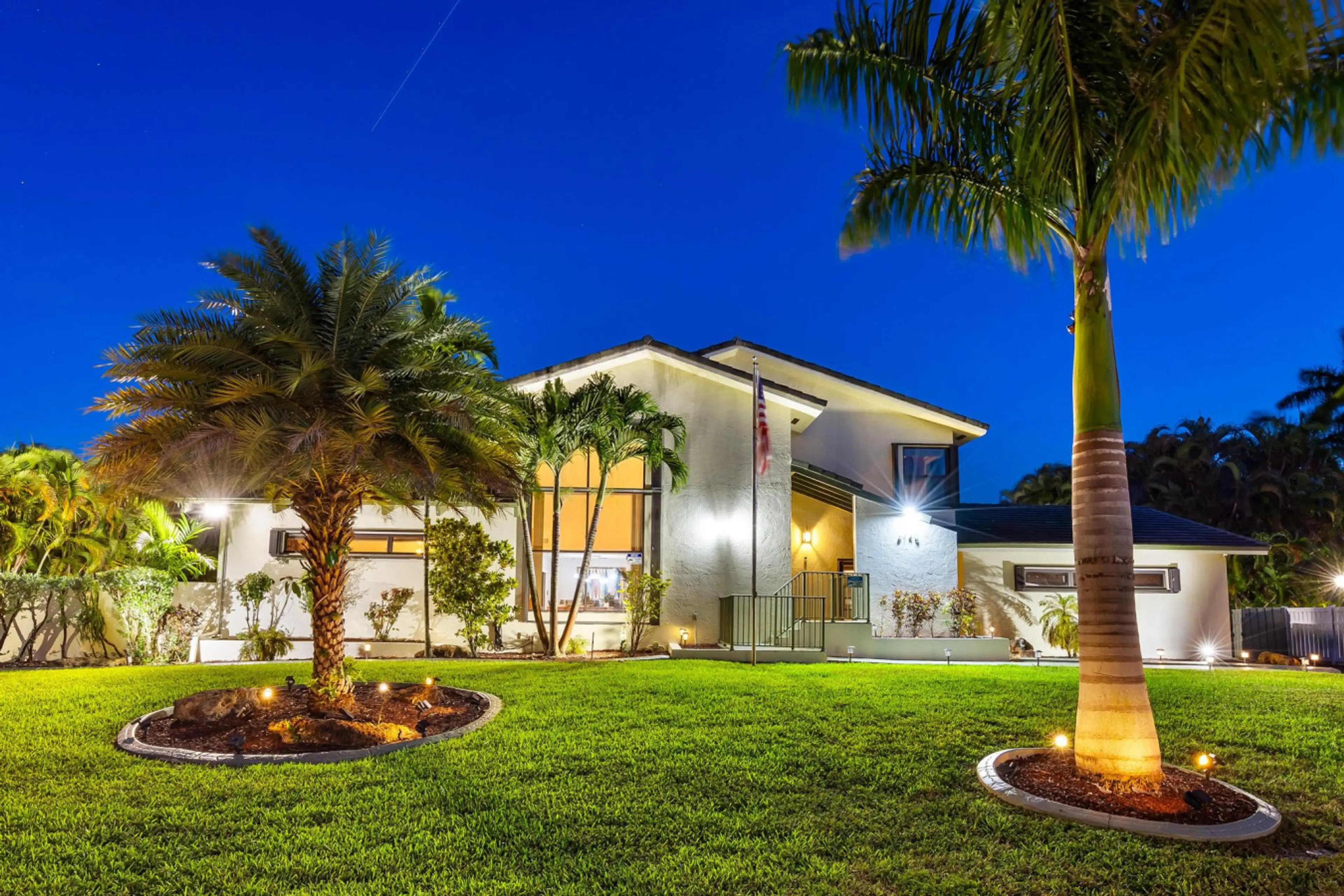 Coastal villa with illuminated grounds and relaxing tropical setting