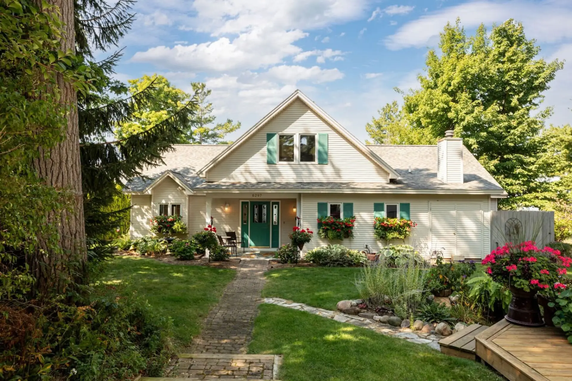 Enjoy the most perfect Northern Michigan home on East Bay.
