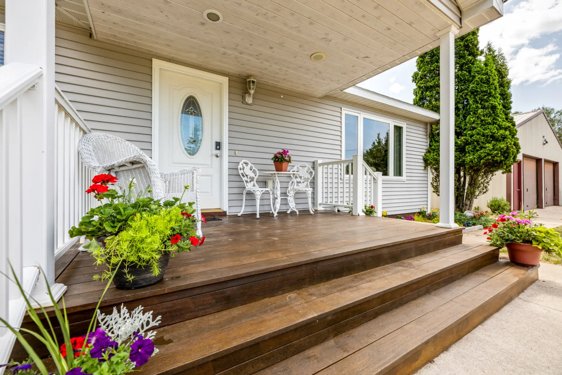 Beautiful front porch sitting area for your morning coffee!