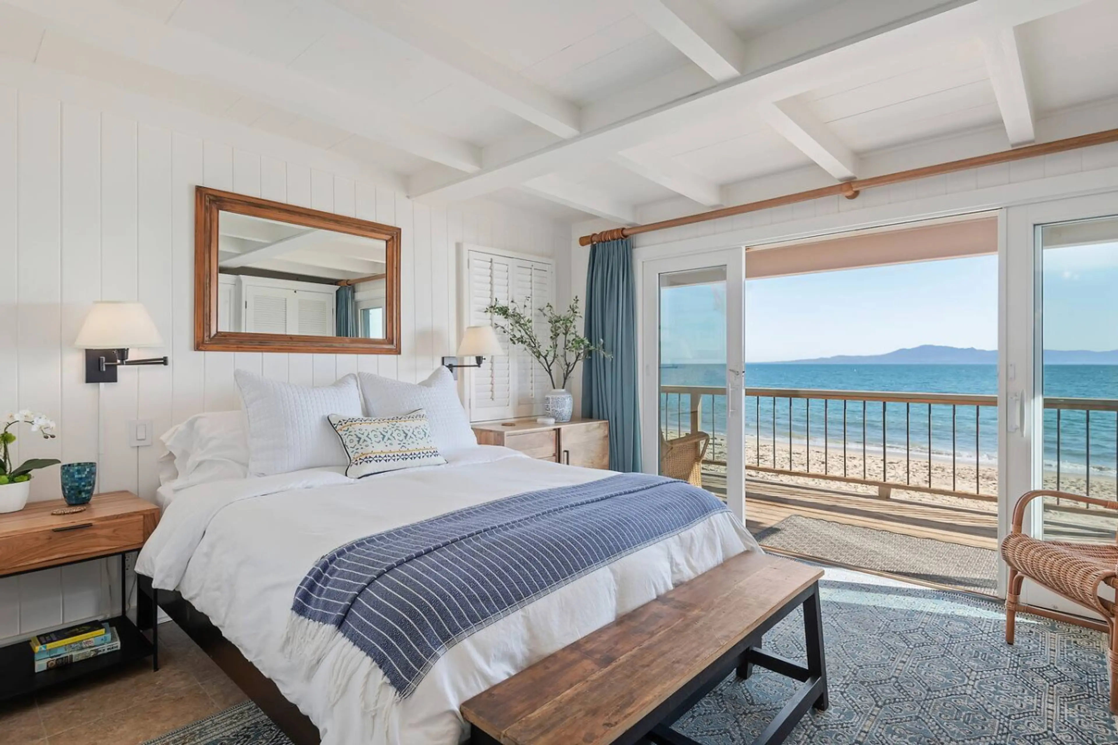 Oceanfront primary bedroom with king bed
