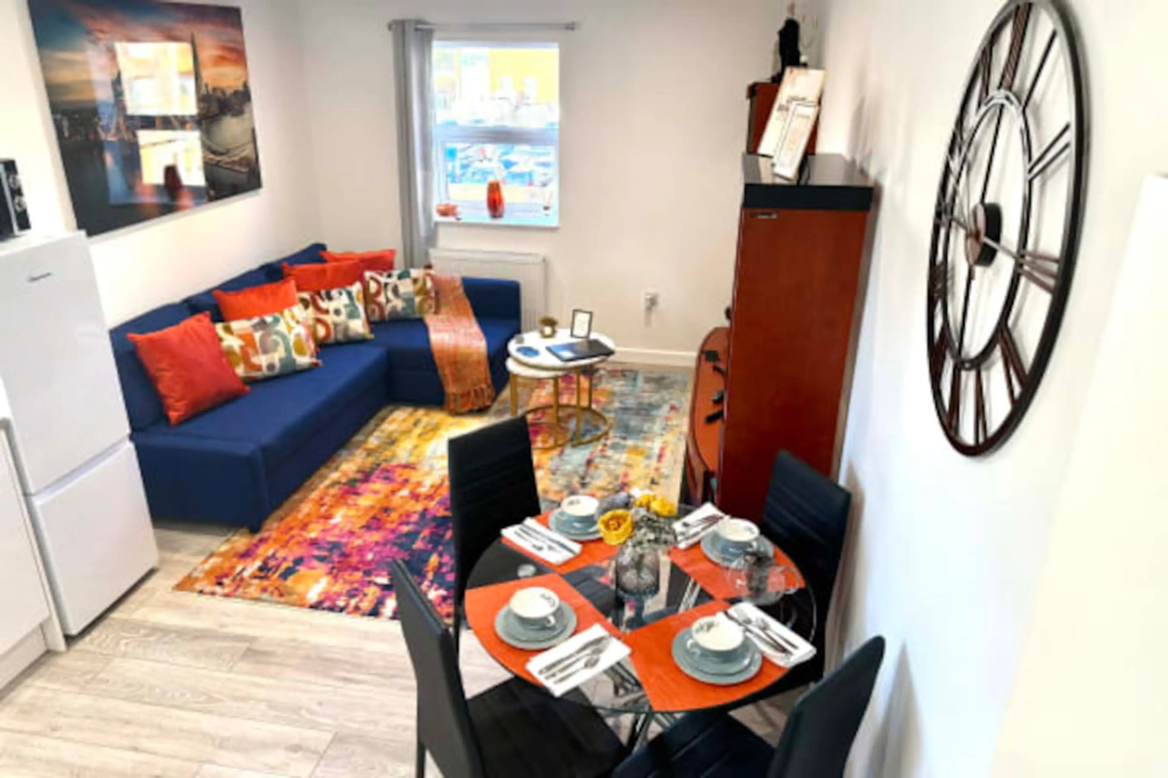 A bright and welcoming space with comfortable seating and a TV, perfect for relaxing after a day out.