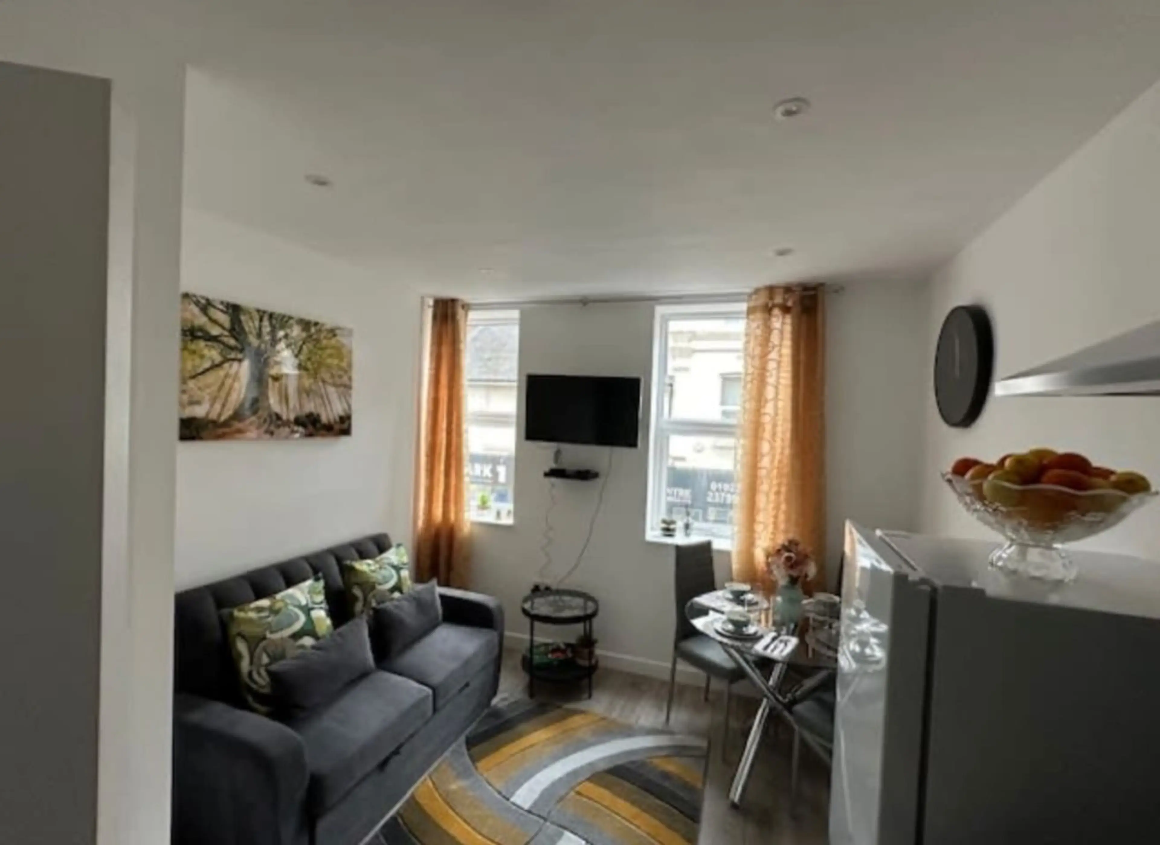 Relax in a cozy lounge with a TV and high-speed WiFi, ideal for streaming or remote work.