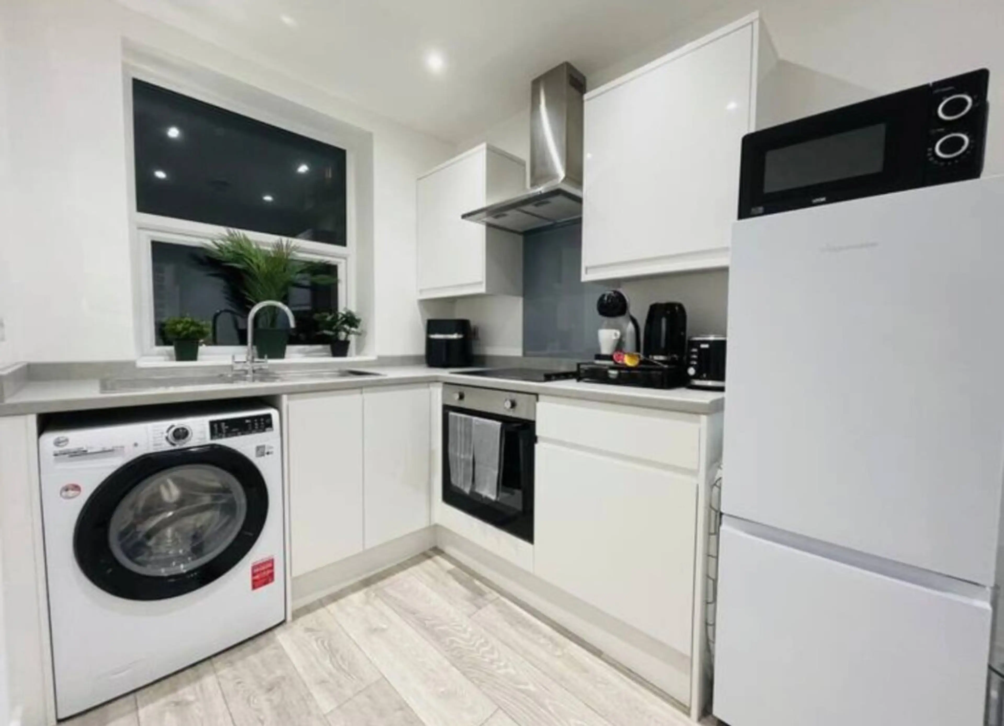 Fully equipped with stove, oven, microwave, fridge, dishwasher, blender, coffee maker, and all cookware to prepare meals with ease.