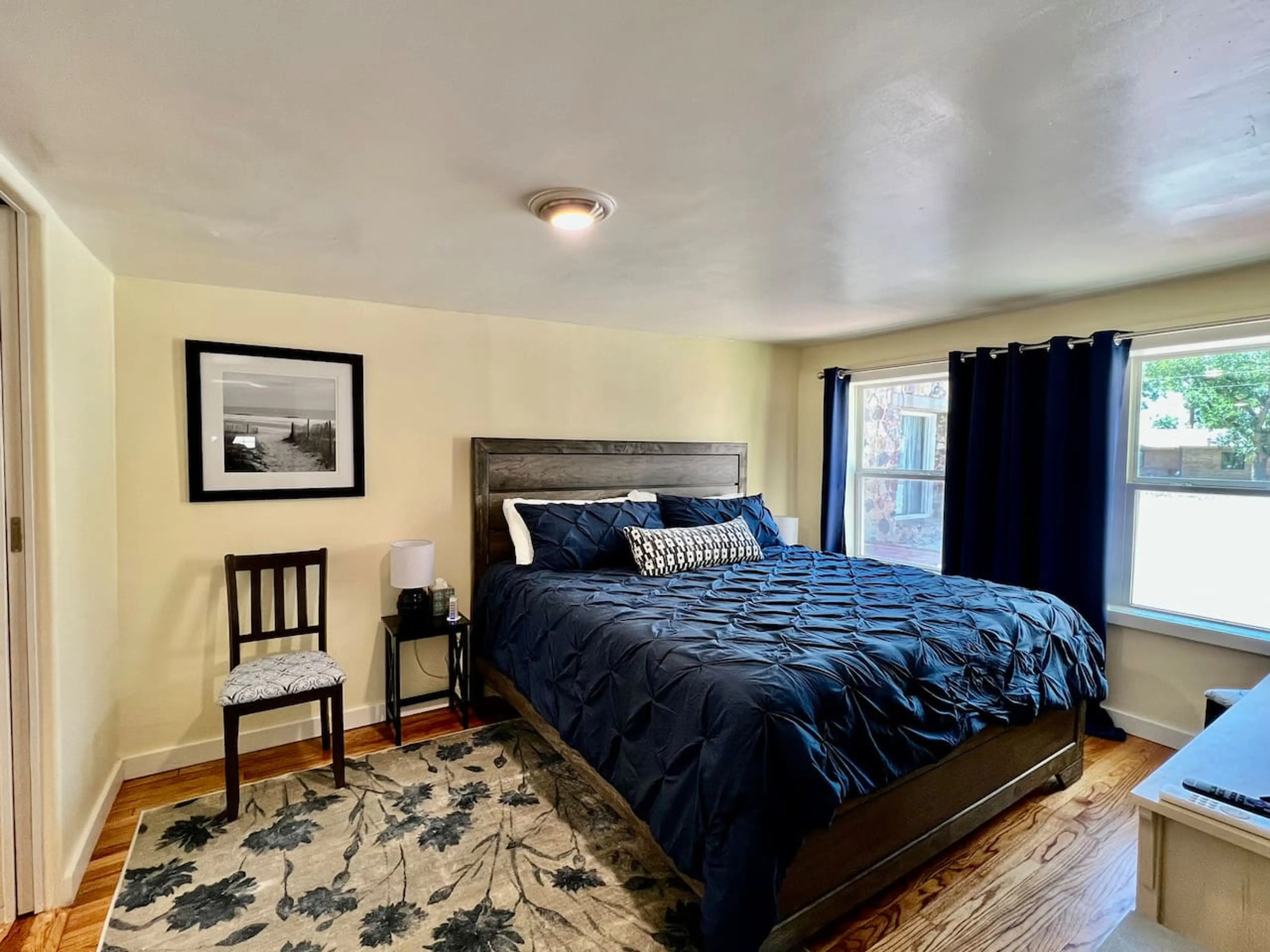 Bedroom - Bed, Seating, and TV, Leads into bathroom