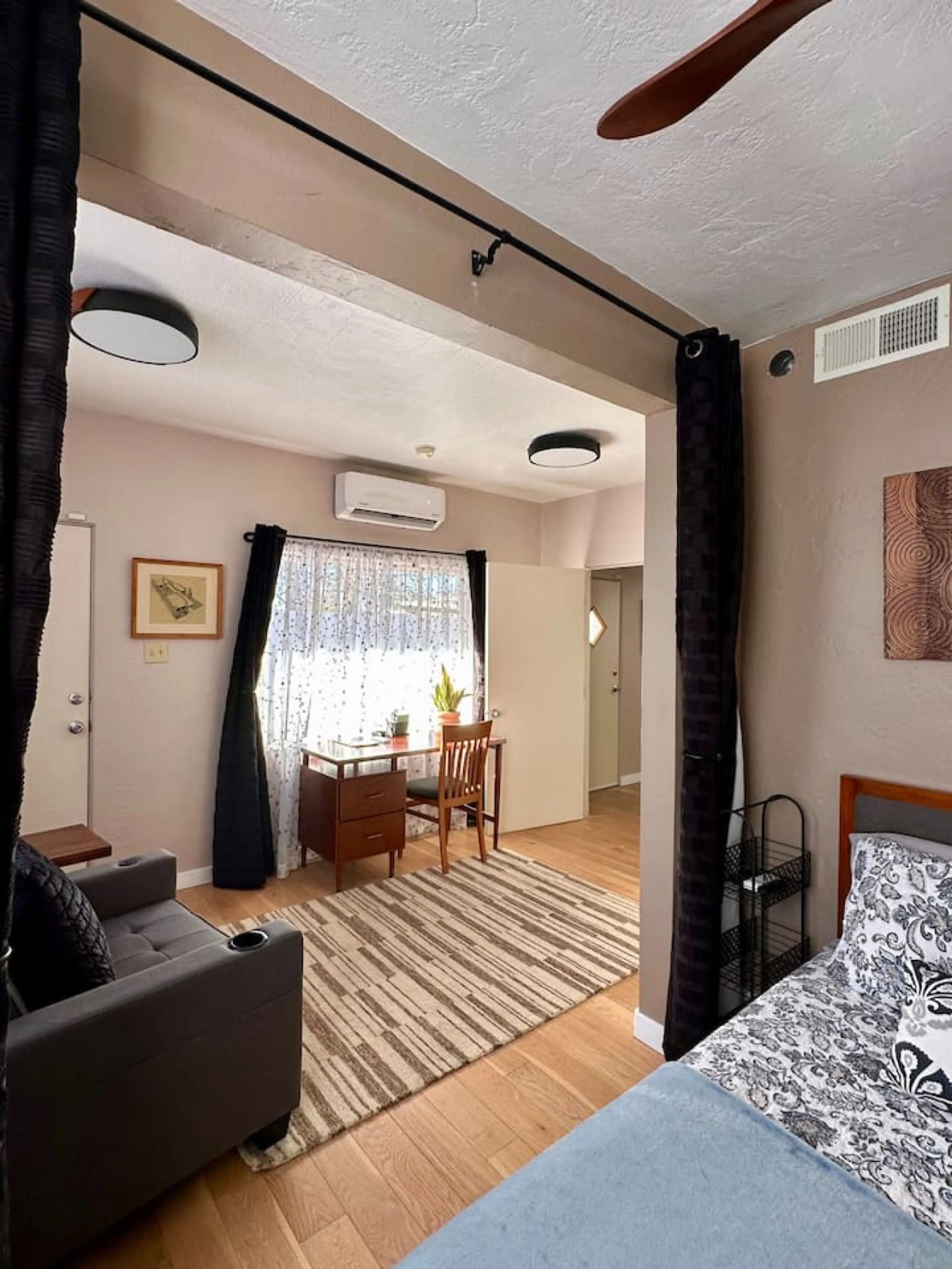 Bedroom view of the desk and seating area - Curtains can be closed