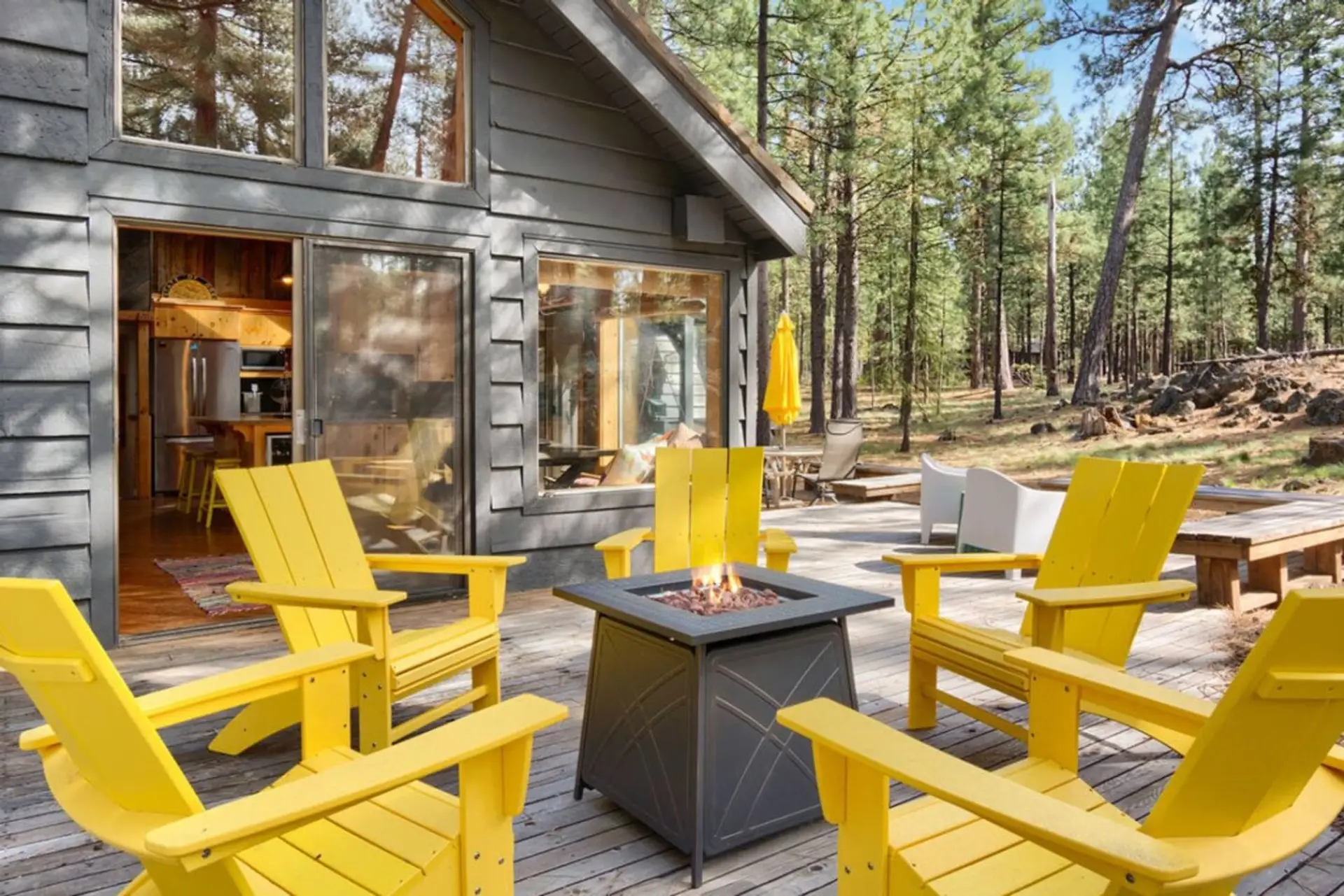 Private fire pit surrounded by pines, perfect for evening hangs