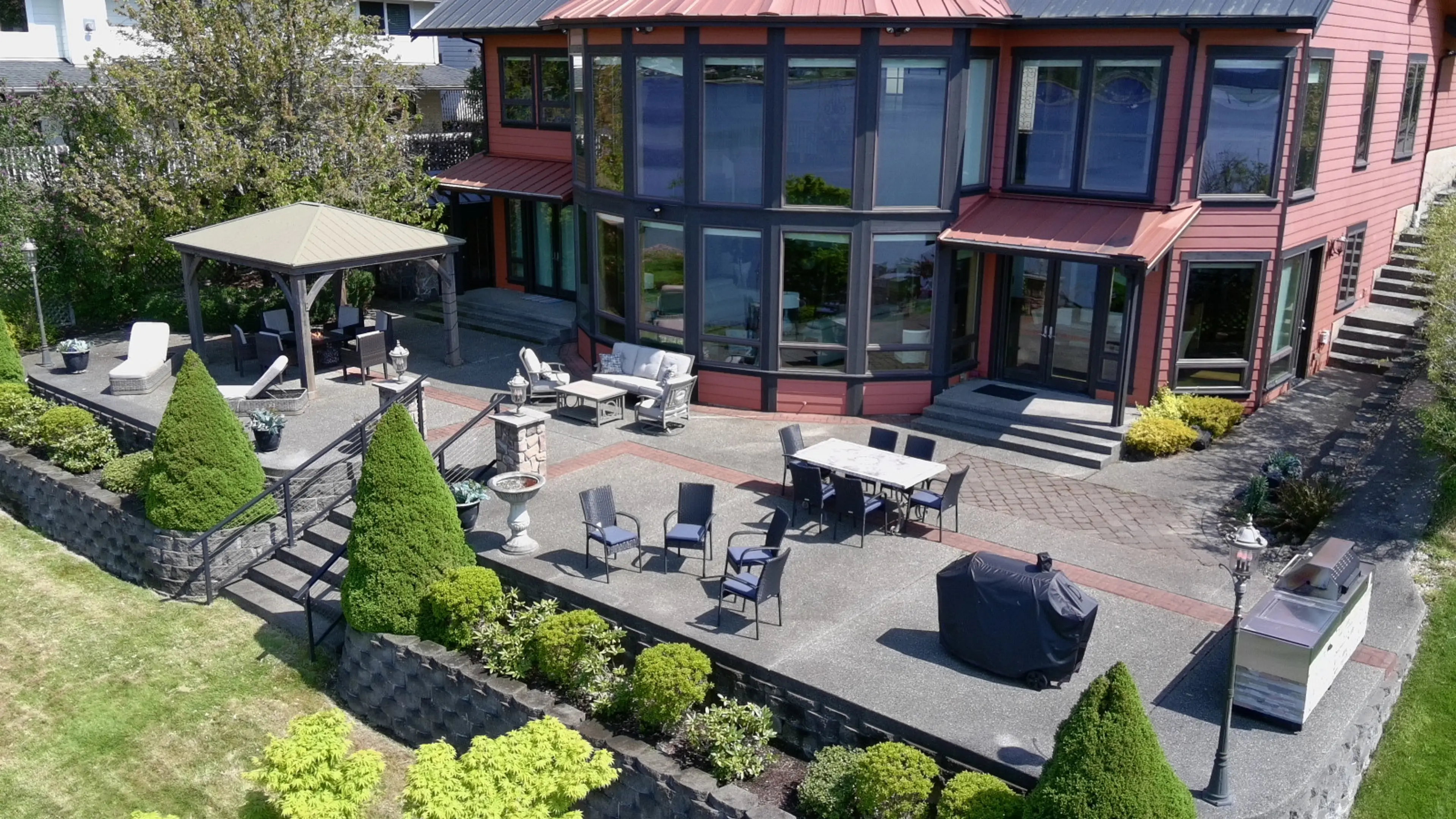 Main House back deck offers plenty of seating to take in views and enjoy a grilled meal