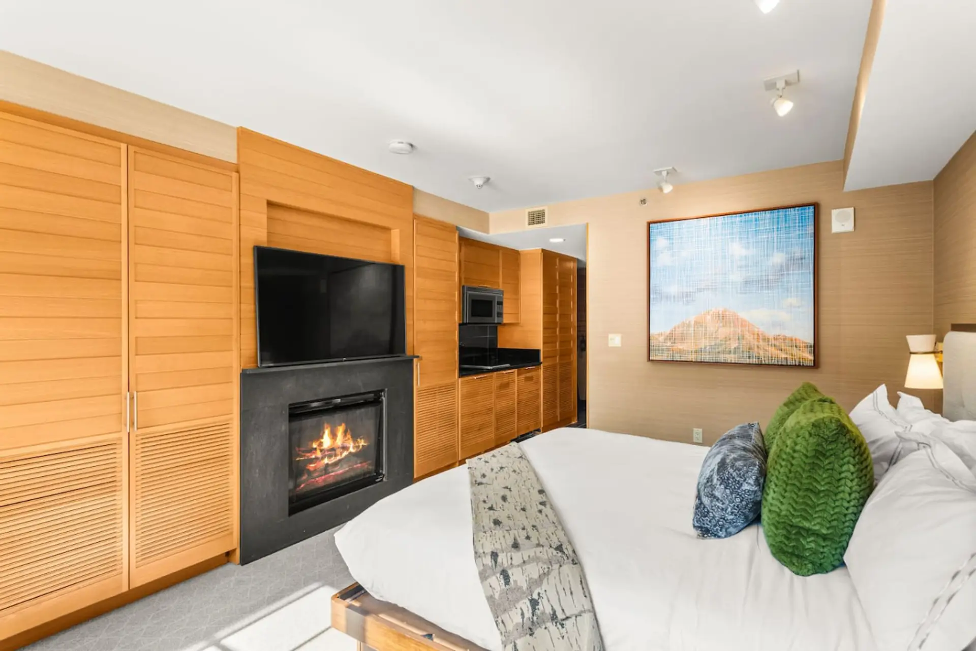The King bed is outfitted with high end linens and a luxury mattress! Enjoy the warmth of the fireplace and convenience of the Smart TV from the comfort of your bed!