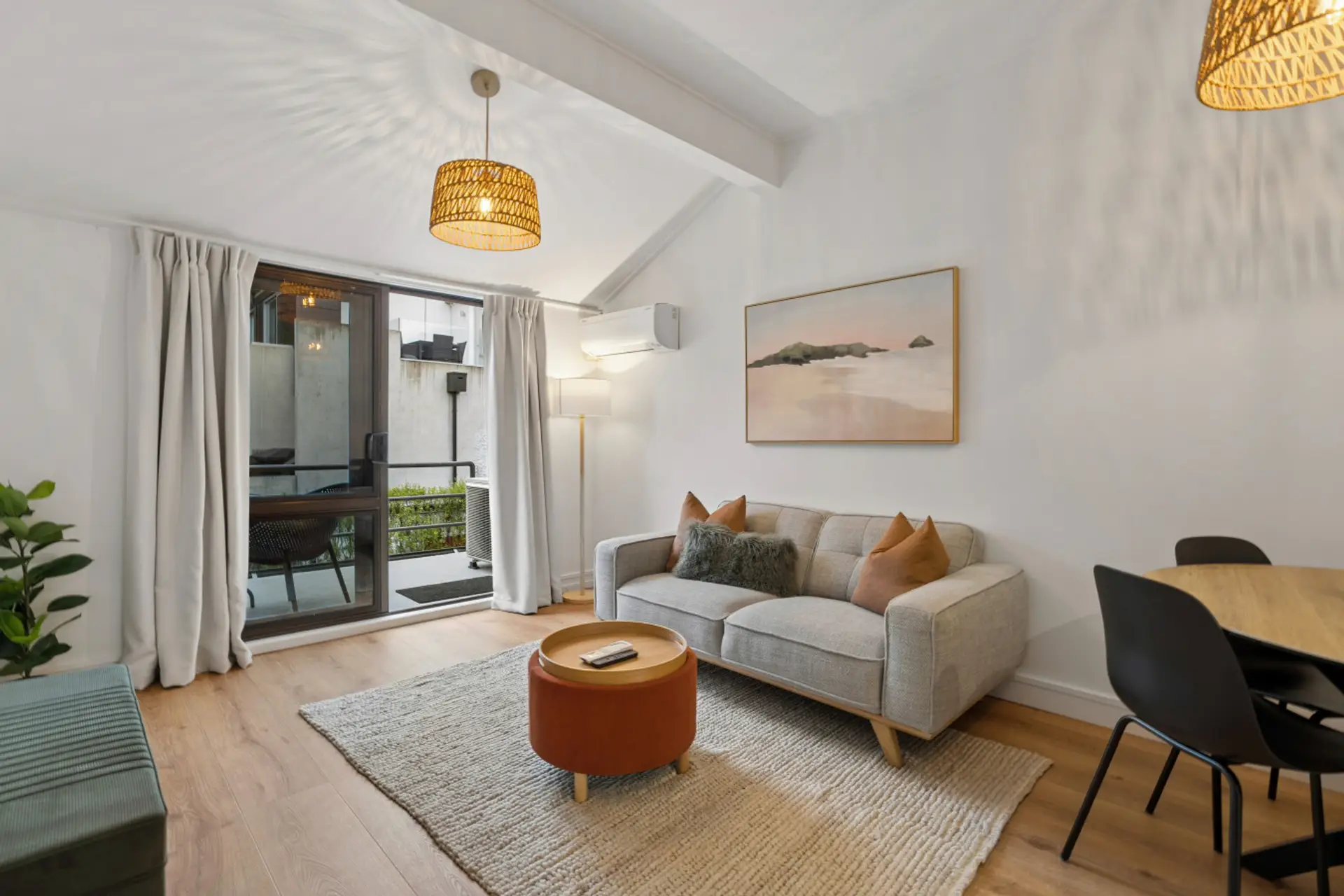 Living Room: Bright and stylish haven with modern decor and balcony views, your perfect retreat!