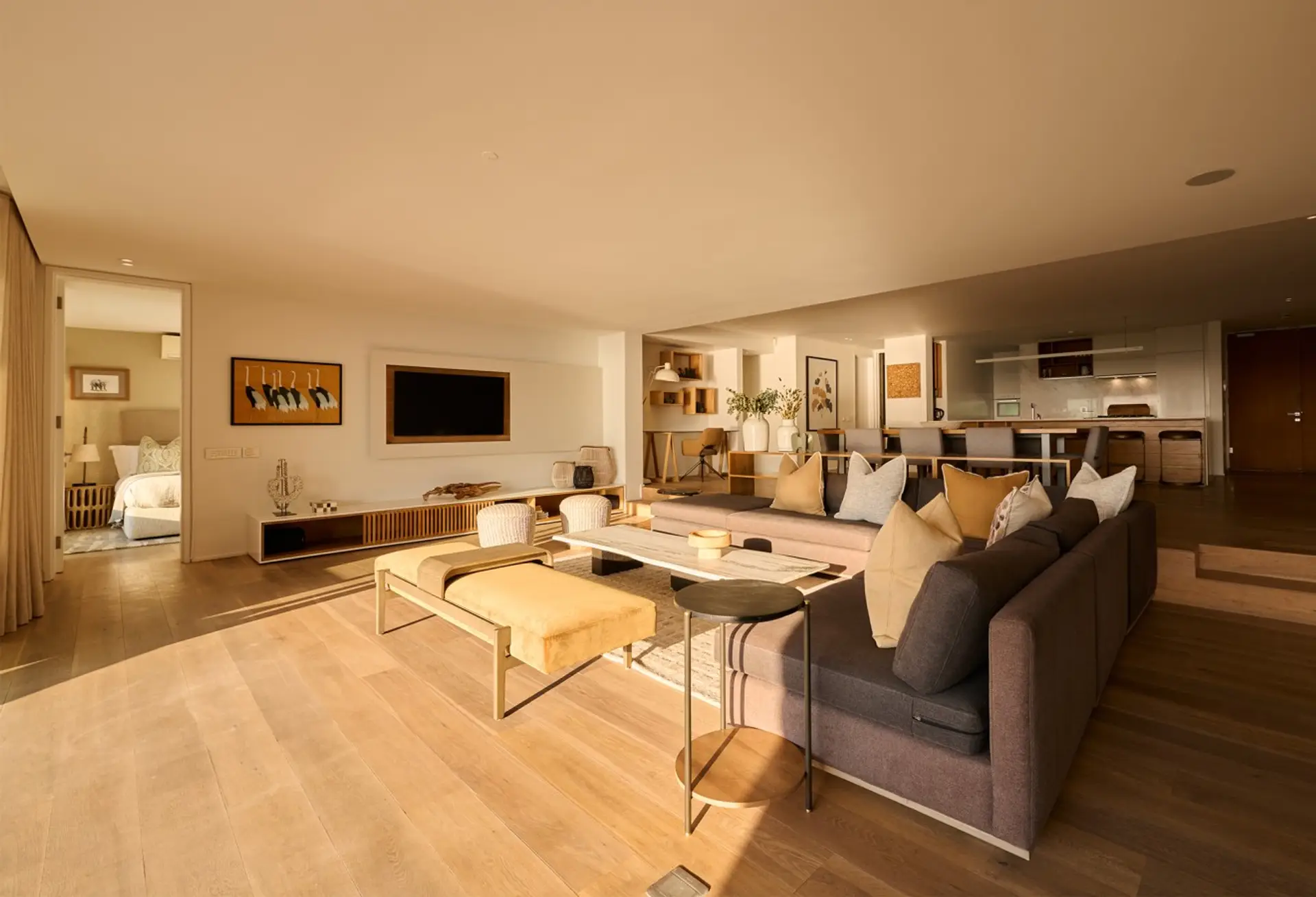 Lounge with a television and upholstered bench