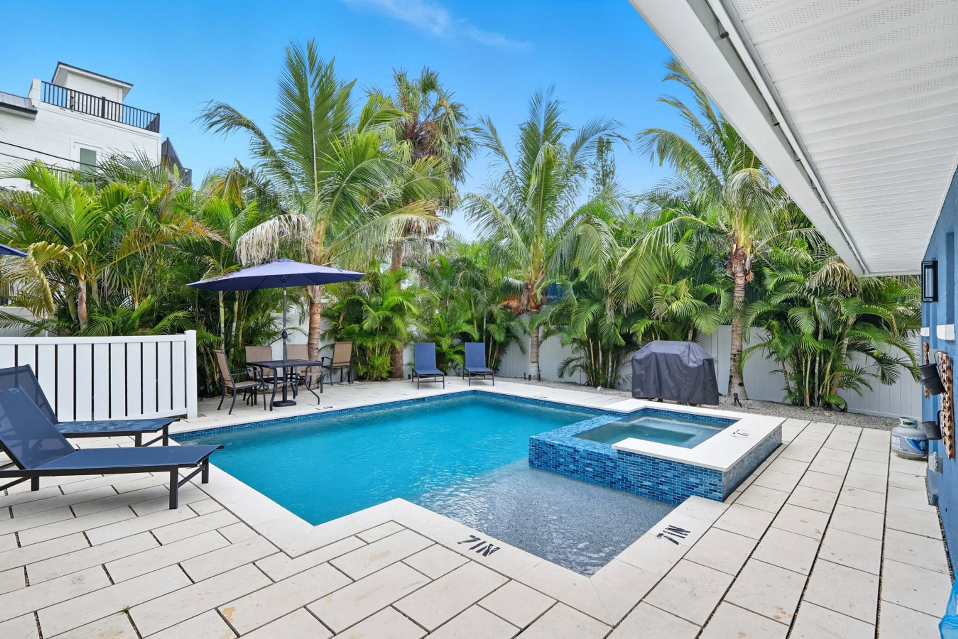 Sunny pool area with loungers and plenty of seating