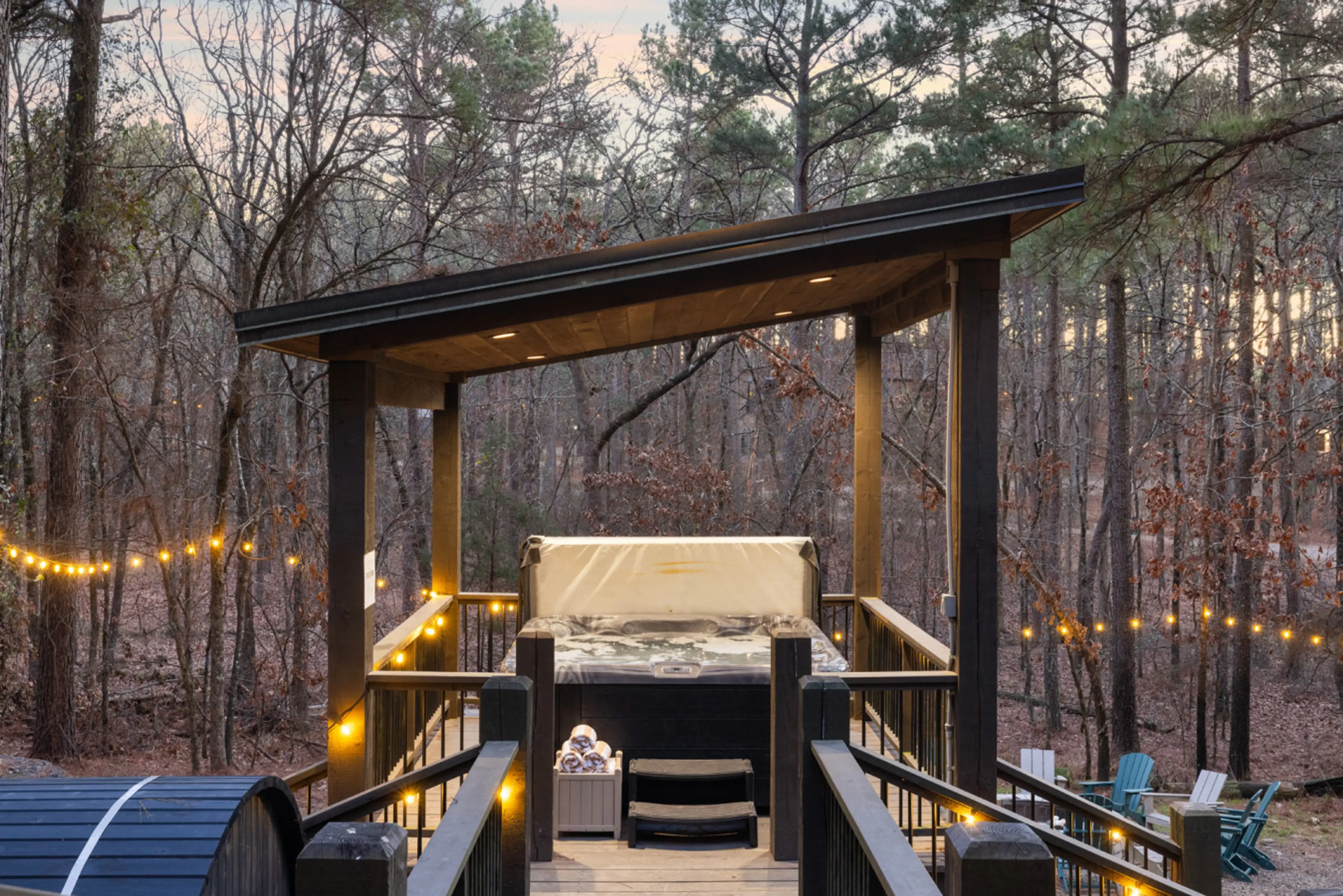 Unwind in our luxury hot tub, sheltered under a modern pergola and surrounded by twinkling string lights for the ultimate evening of relaxation.