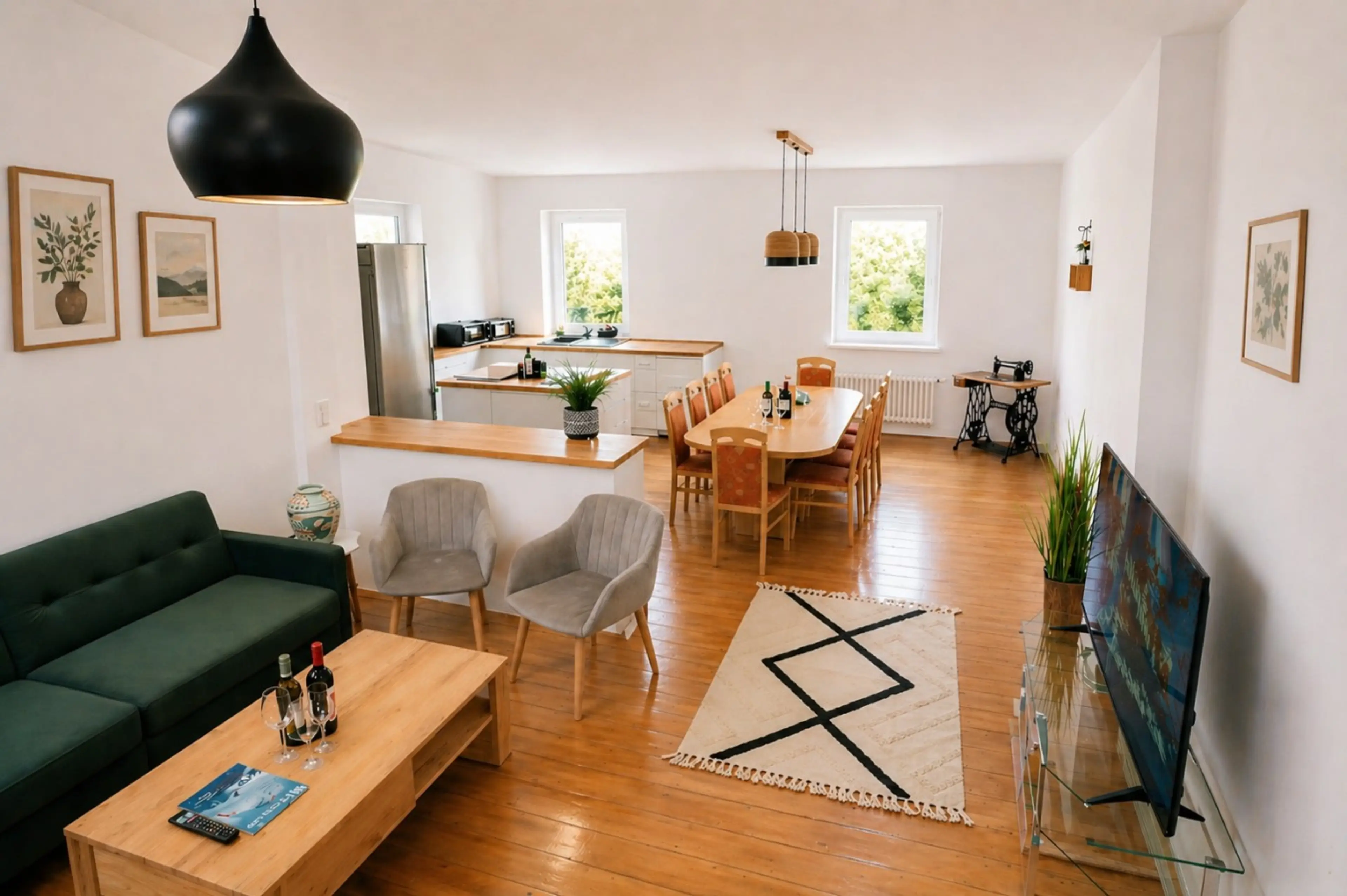 Enjoy a spacious open-plan living area with comfortable seating, dining space, and a fully equipped kitchen.