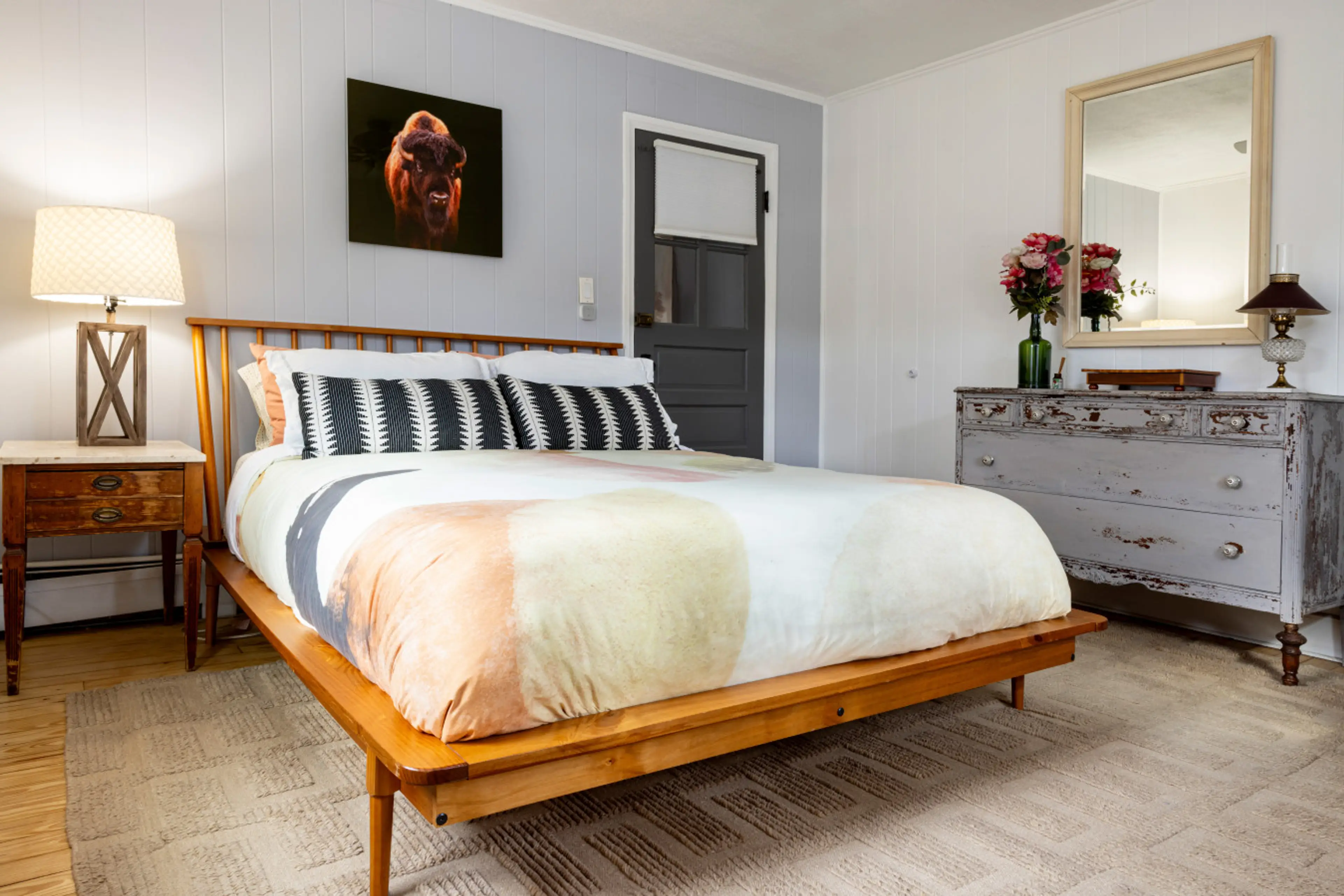 he master bedroom features beautiful natural daylight during the day and an air conditioner for comfort in the warmer months. The bed is made with soft organic cotton bedding, a feather blanket, plush pillows, and a mattress topper for extra comfort. The