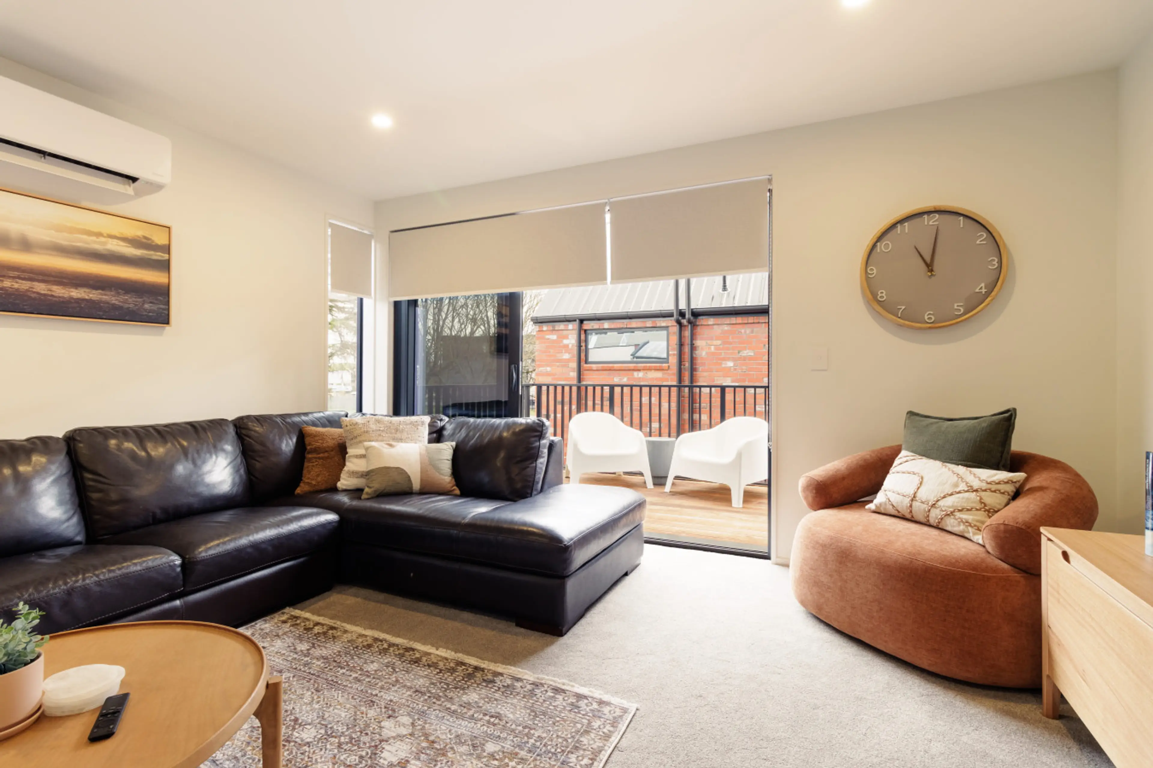 Bright modern living area designed for comfort and seamless indoor-outdoor living.