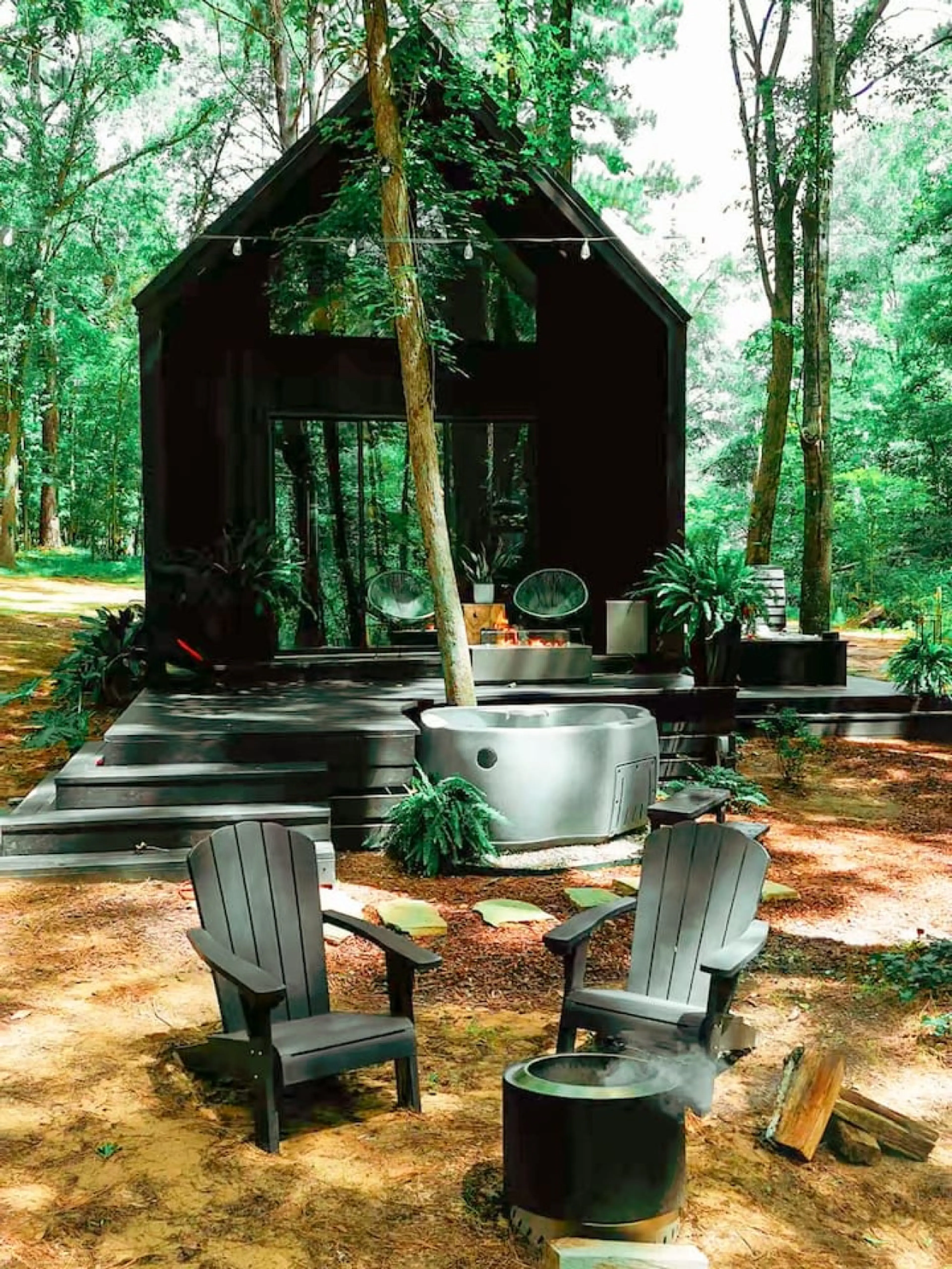 Unwind in your private cedar hot tub, surrounded by towering trees and peaceful forest views.