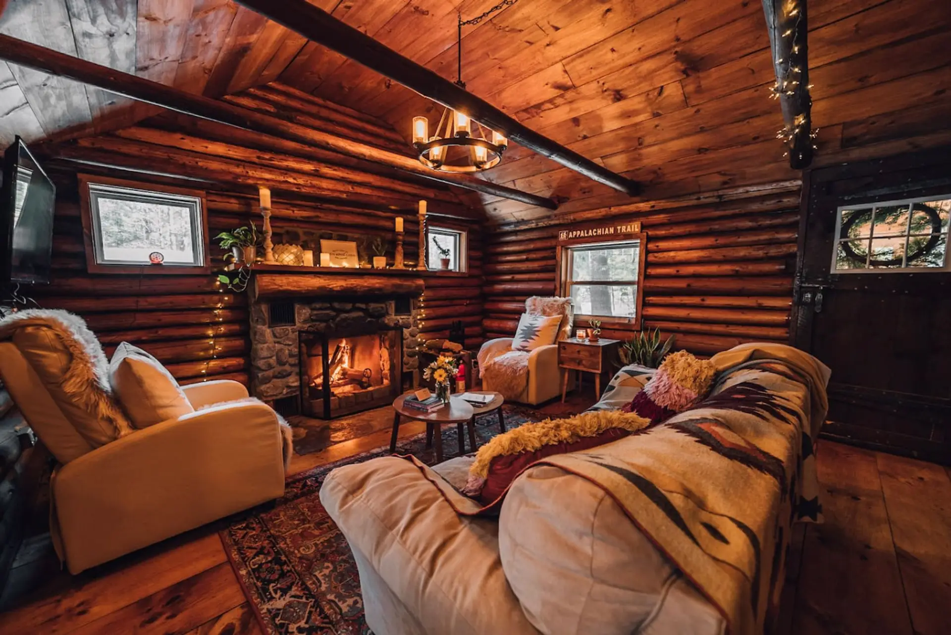 The living room has a large couch with two recliners. All are comfy cozy! The fireplace is wood-burning.