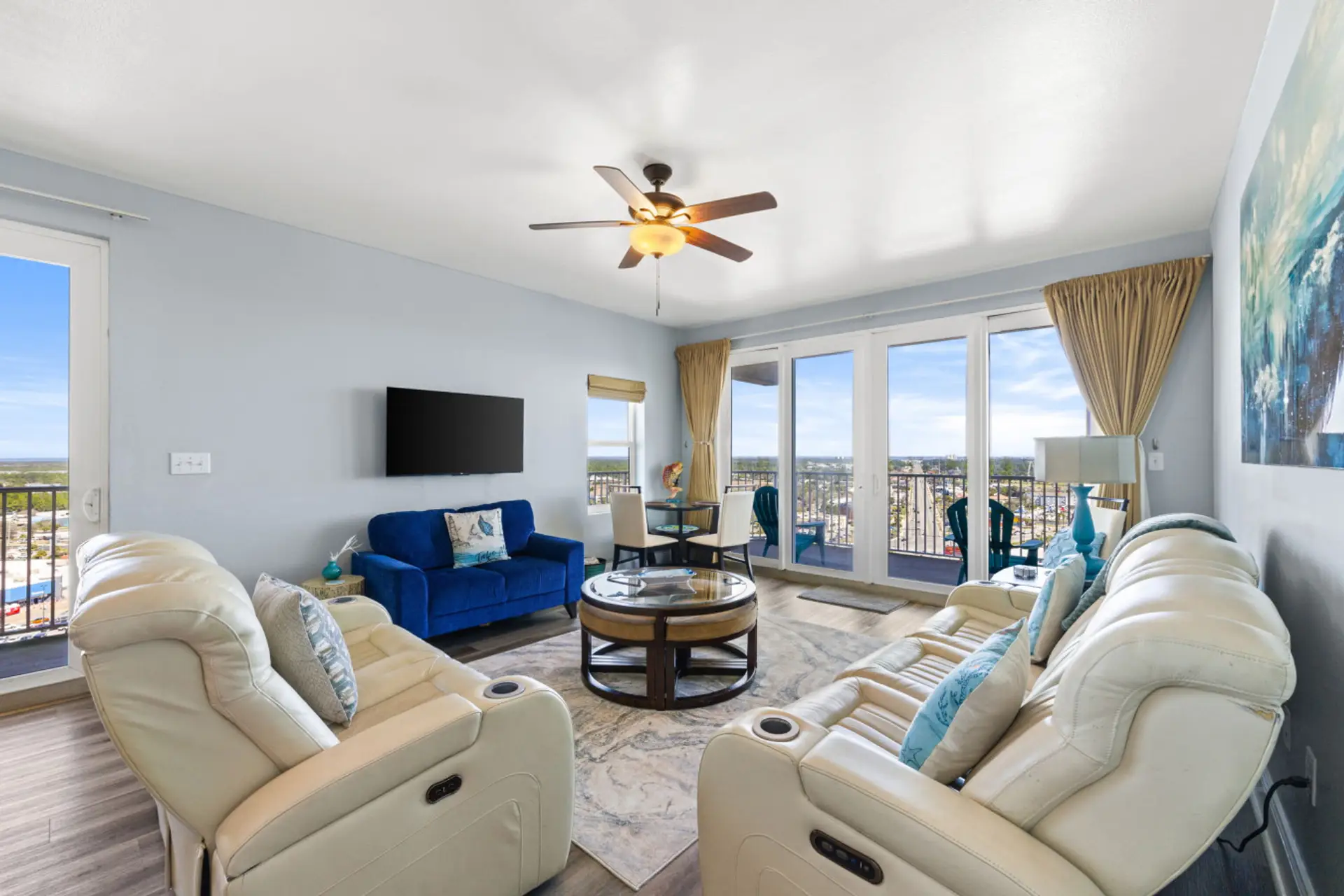Lakefront Living Area with Flat Screen TV and Private Balcony Access