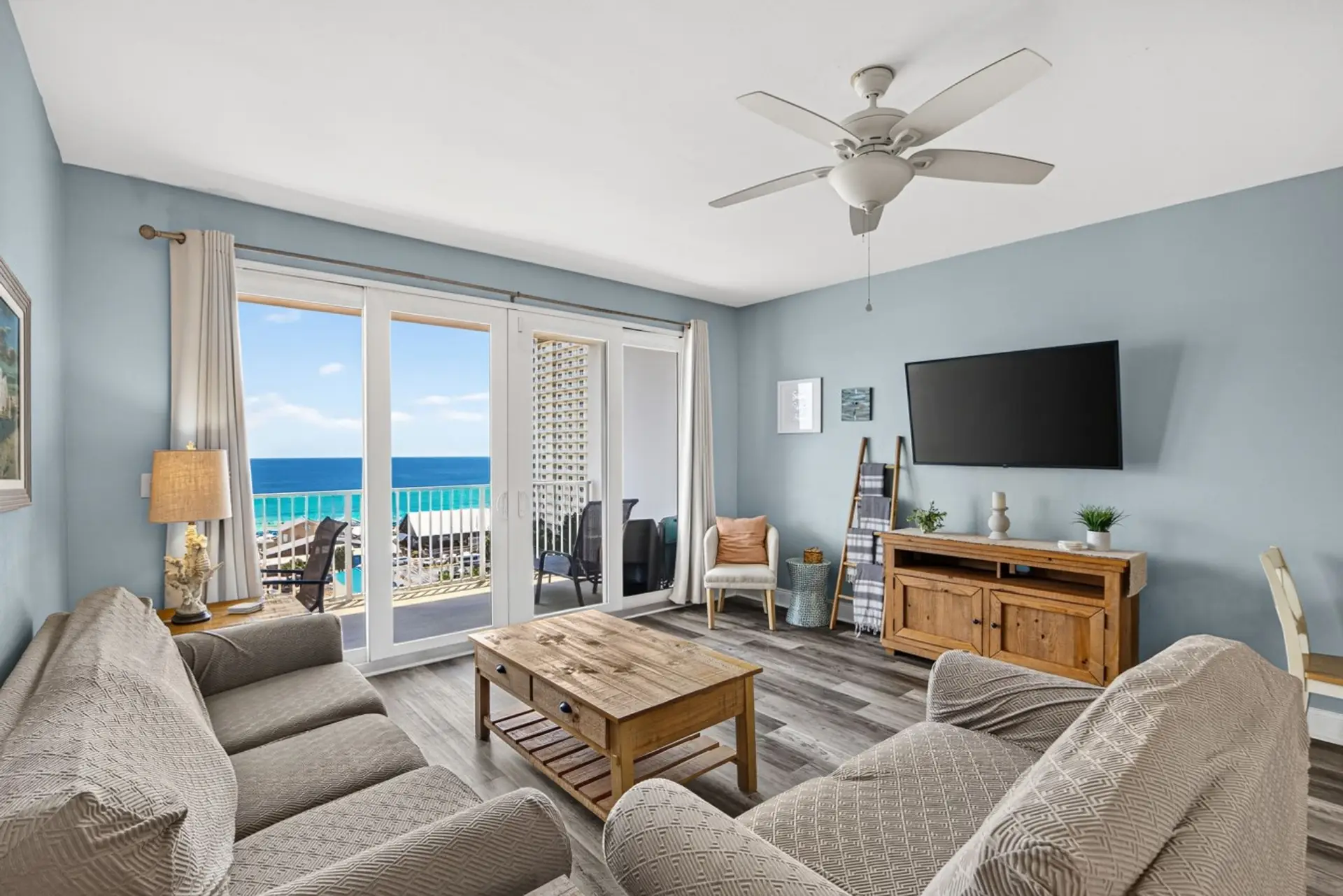 Ocean View Living Room with Private Balcony Access and TV