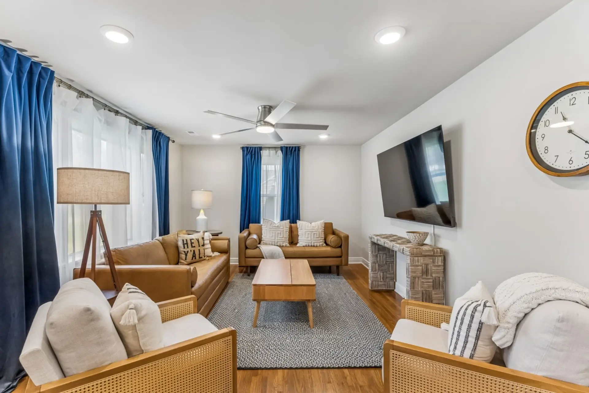 Spacious living room with queen sofa bed, Smart TV, ceiling fan, and plenty of space for your group.