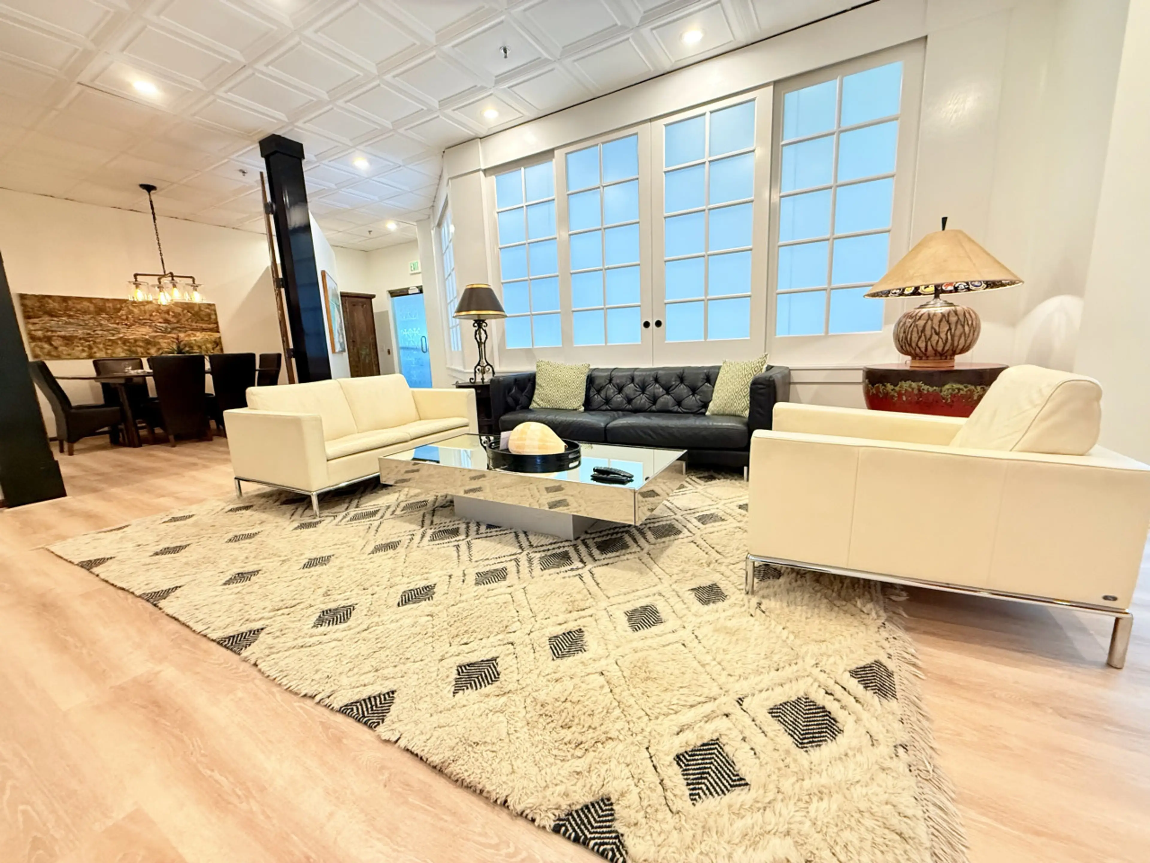 Expansive Living Room With Doors Leading to Dining Area