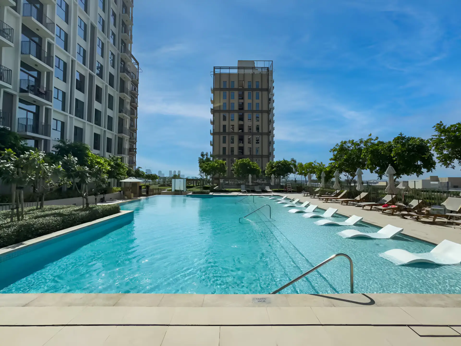 Poolside Paradise: Bask in the sun by the shimmering pool, surrounded by lush greenery and stunning views!