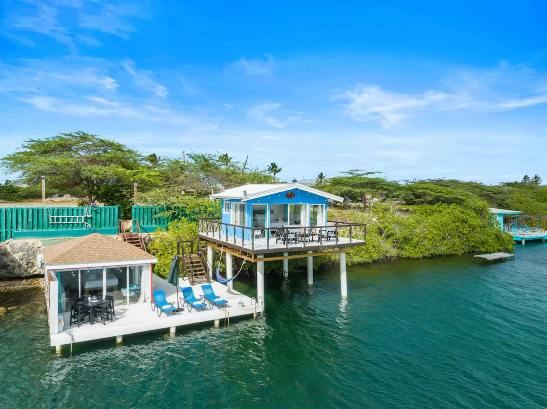 Unique waterfront villa with private dock, right beside a local marina.