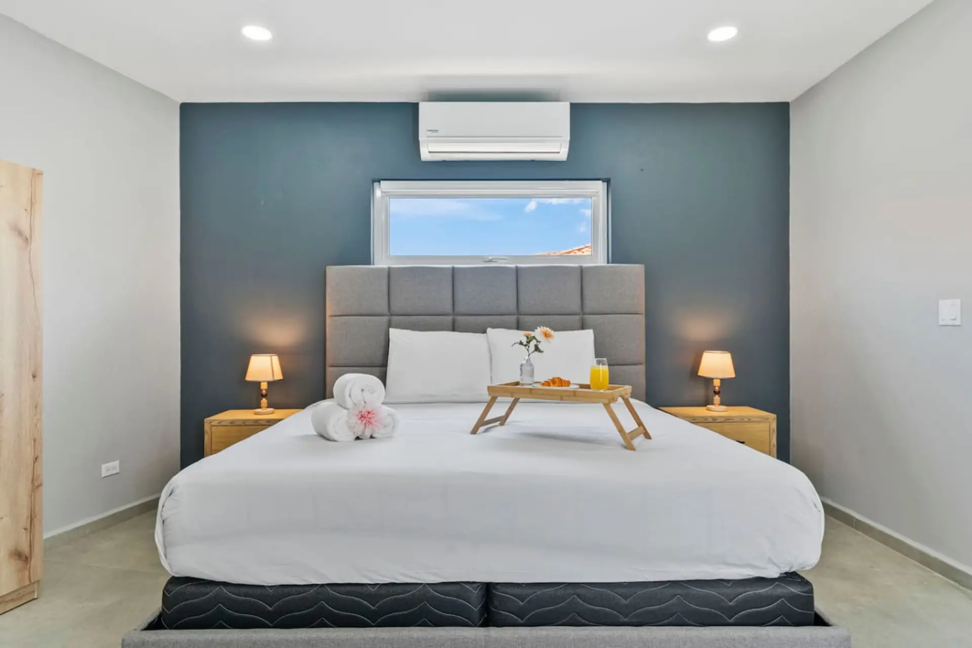 This bright bedroom offers a calm retreat with stylish decor, soft natural light, and a relaxing atmosphere for peaceful Aruba nights