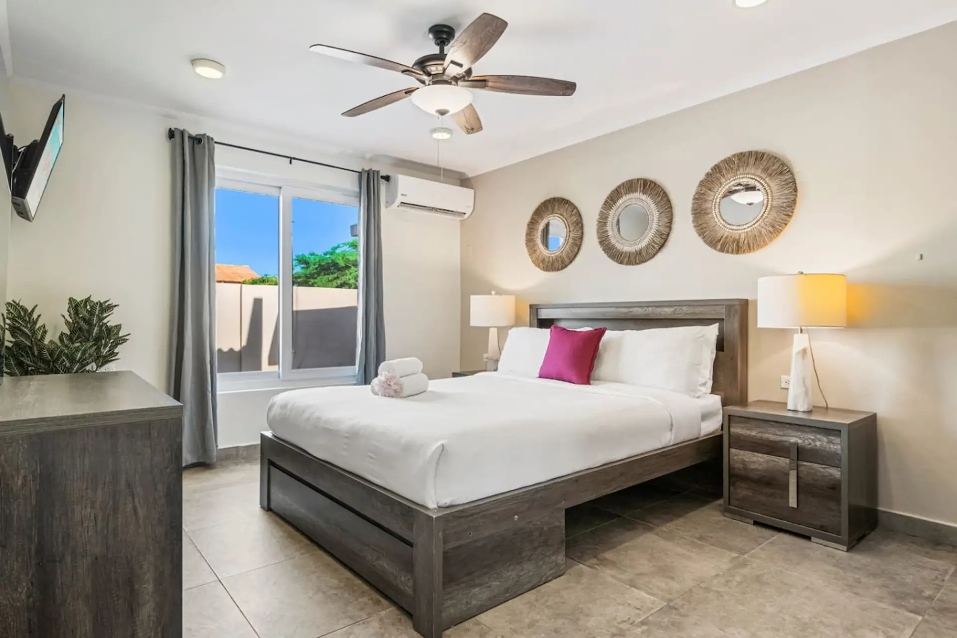Comfortable bedroom featuring king bed and private patio access