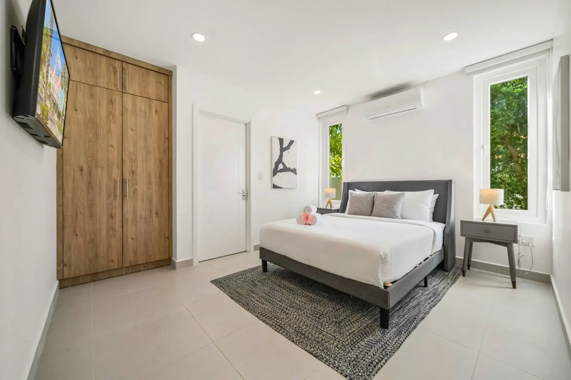 Queen bedroom with garden view and cozy linens for peaceful sleep
