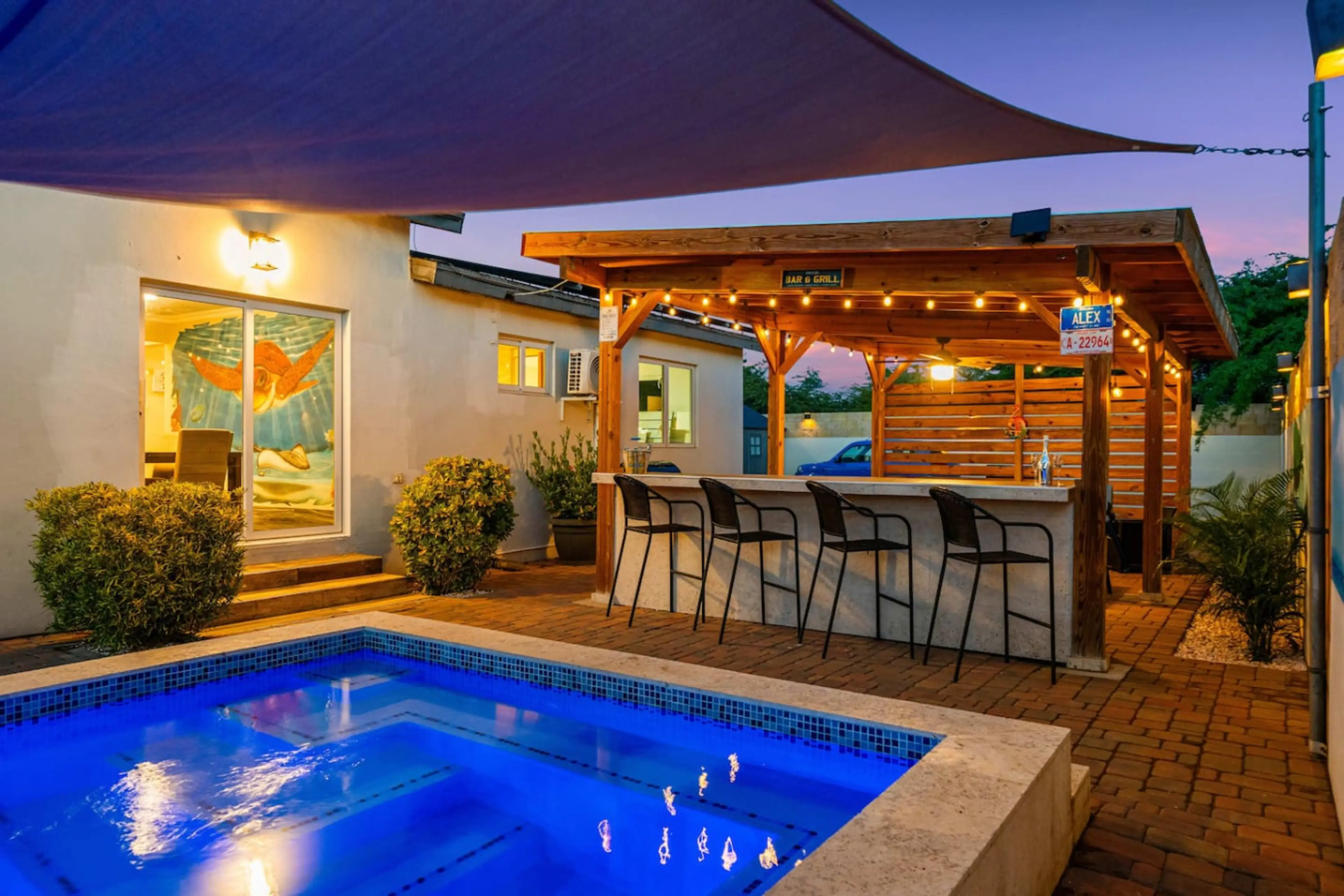 Nighttime pool and bar area for unforgettable Aruba evenings