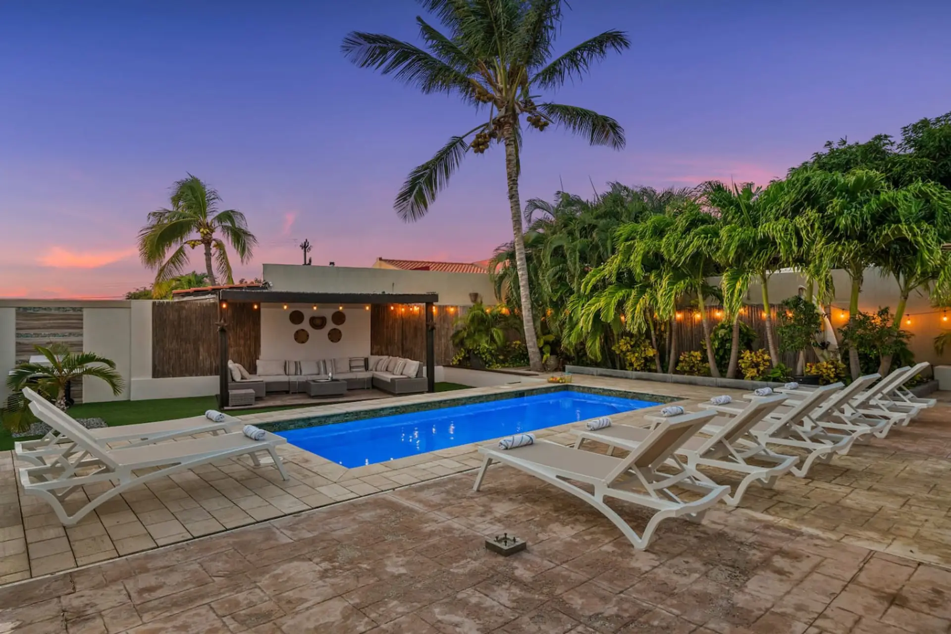 Spend sunset moments by your private pool, surrounded by lush palms, warm island light, and a peaceful outdoor setting made for easy Aruba relaxation
