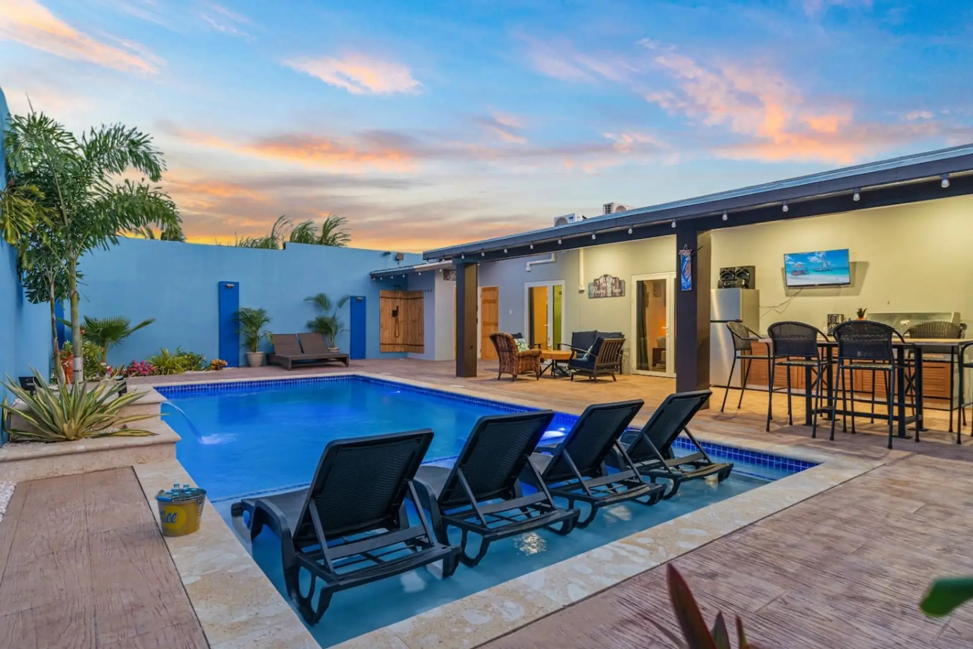 Unwind by the shimmering pool with stunning sunset views, tropical charm, and a peaceful setting perfect for refreshing dips and laid-back island evenings.