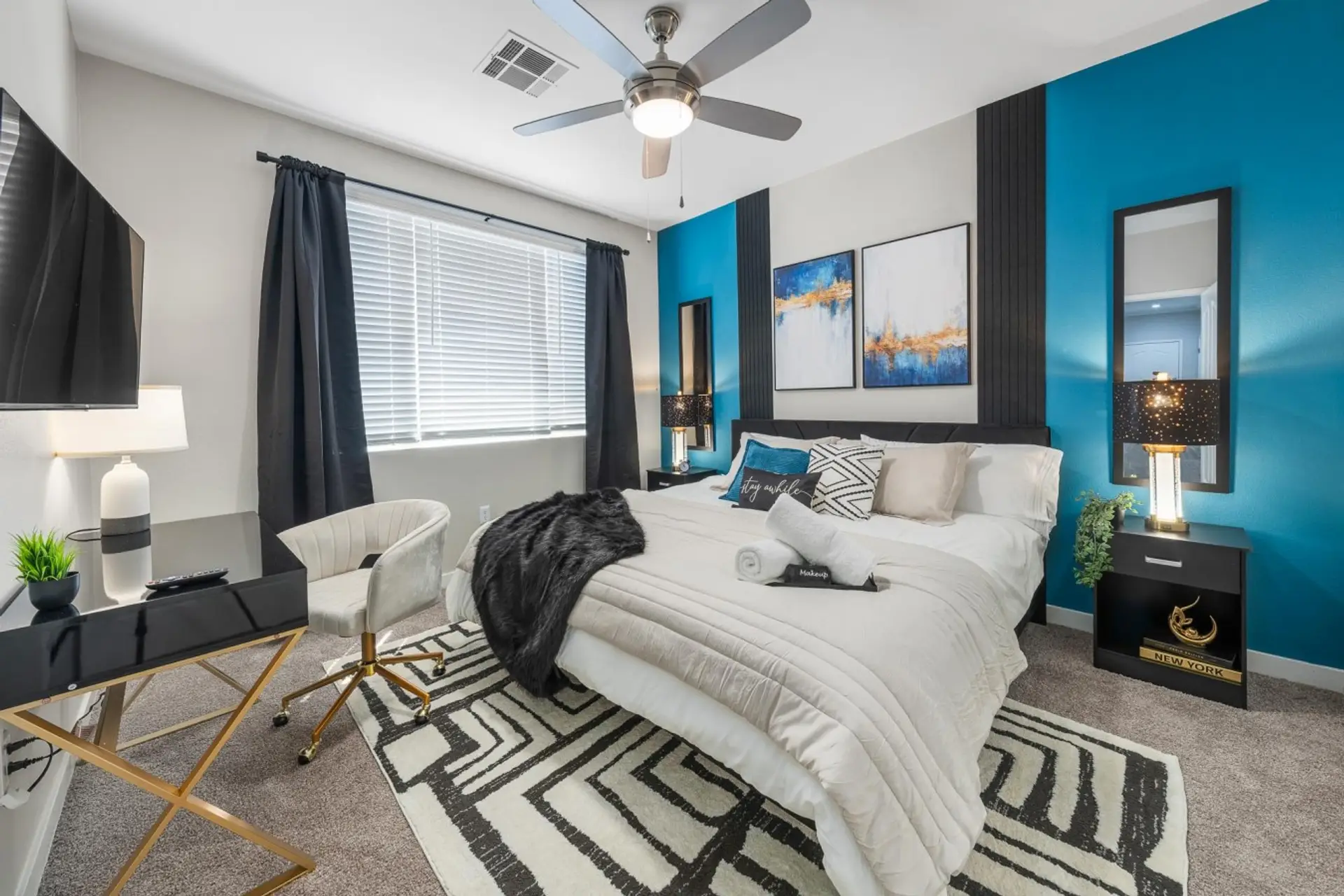 Spacious primary suite featuring a plush king bed and private ensuite bathroom.