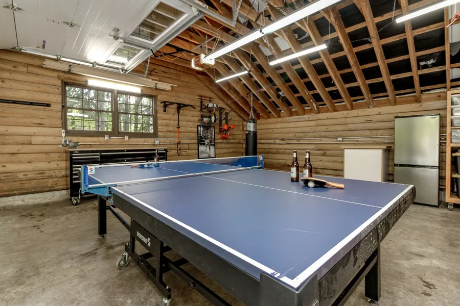 Detached heated game room with ping-pong table