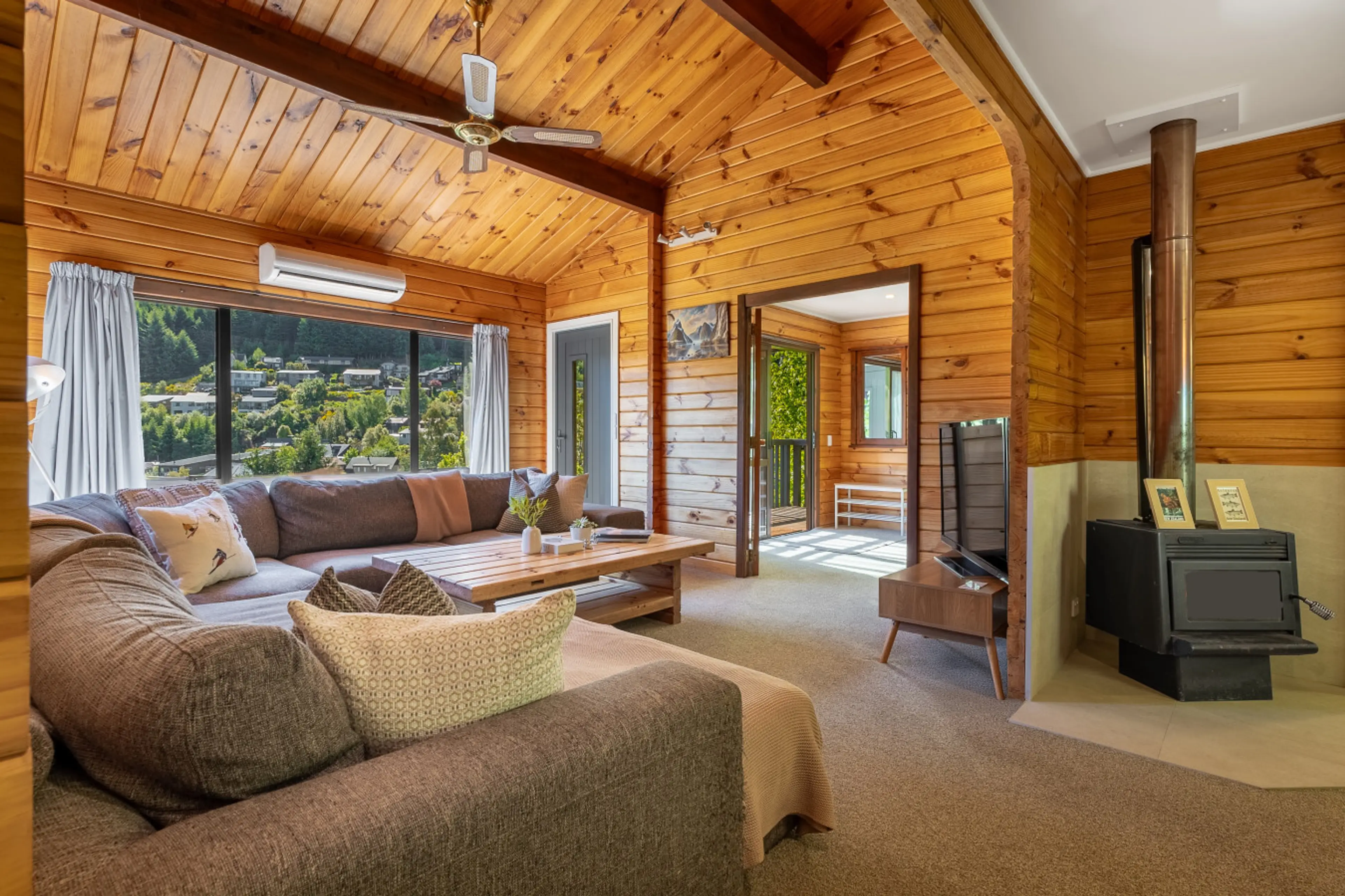 Open plan living area makes for an inviting place to relax (fire not for guest use)