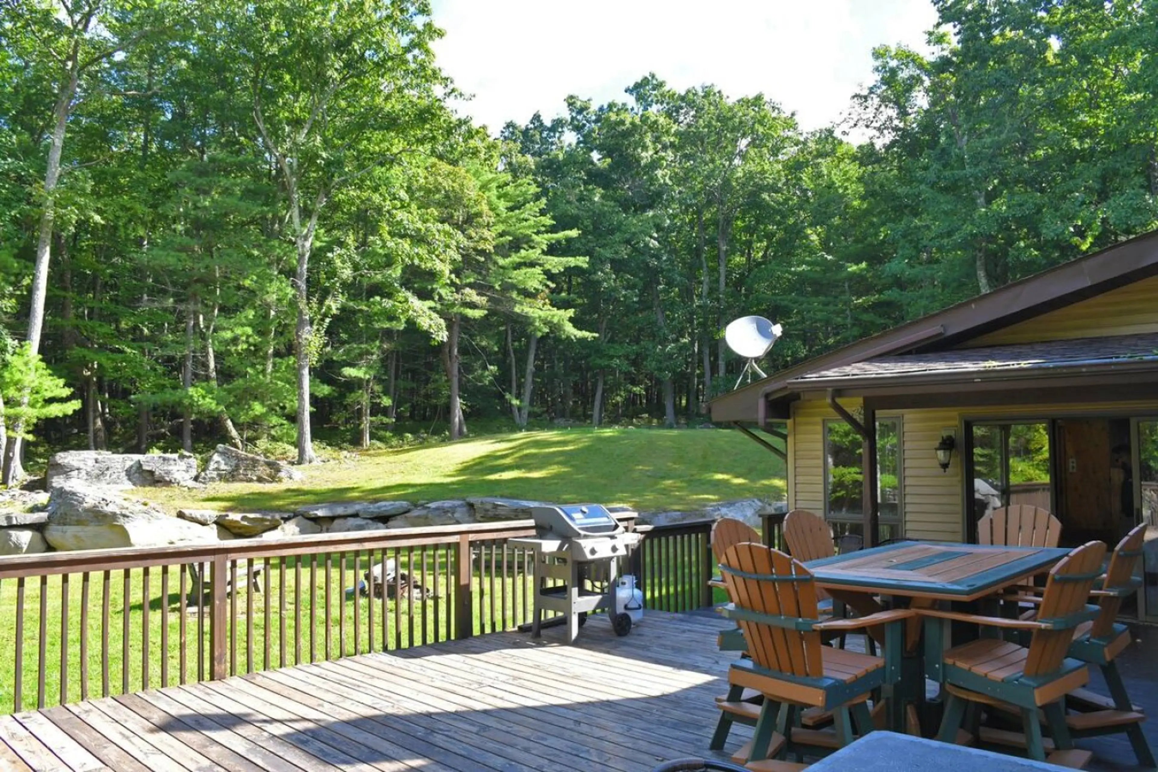 Wrap Around Deck with Seating, Propane Grill and Level Backyard