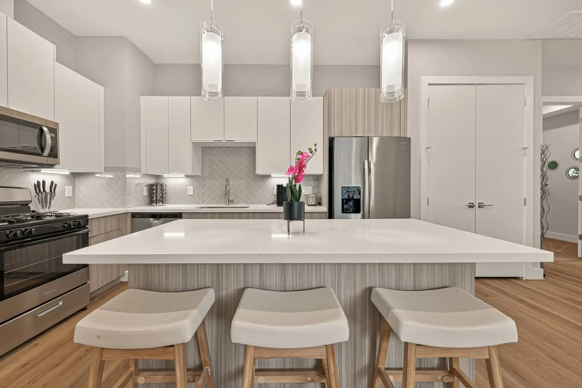 Gourmet Kitchen: Modern design, chic lighting, and a perfect island for your culinary creations