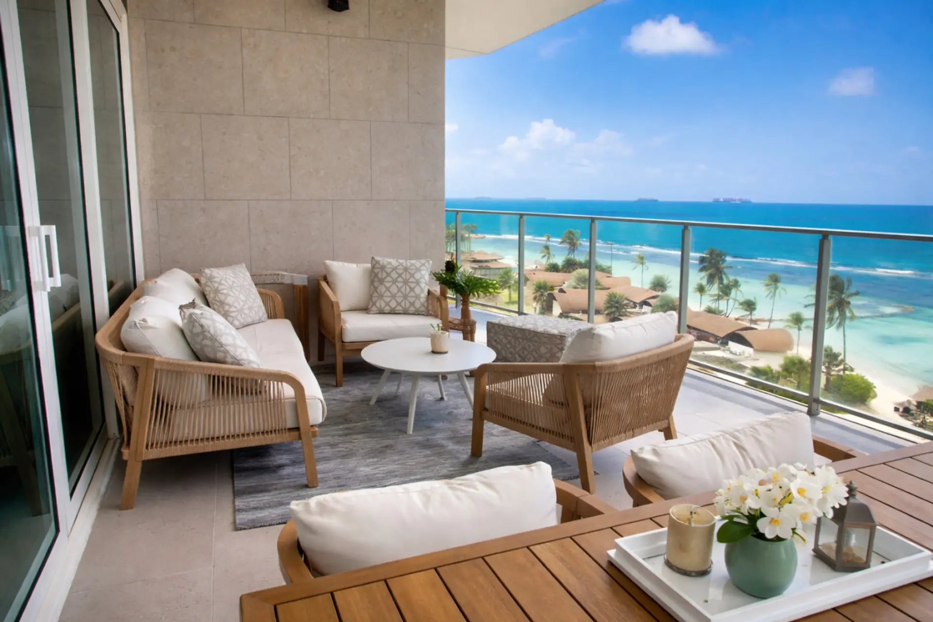 Private oceanview terrace with comfortable seating, ideal for relaxing and enjoying the view.