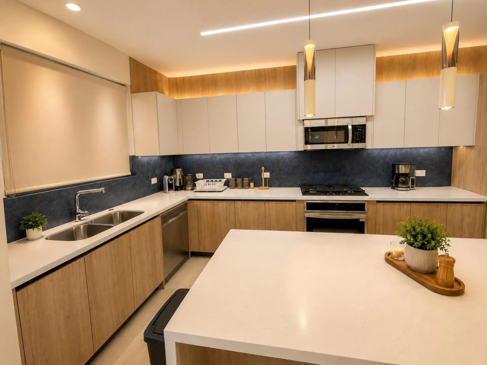 • Fully equipped gourmet kitchen featuring a large island, premium appliances, and everything needed for home-cooked meals.