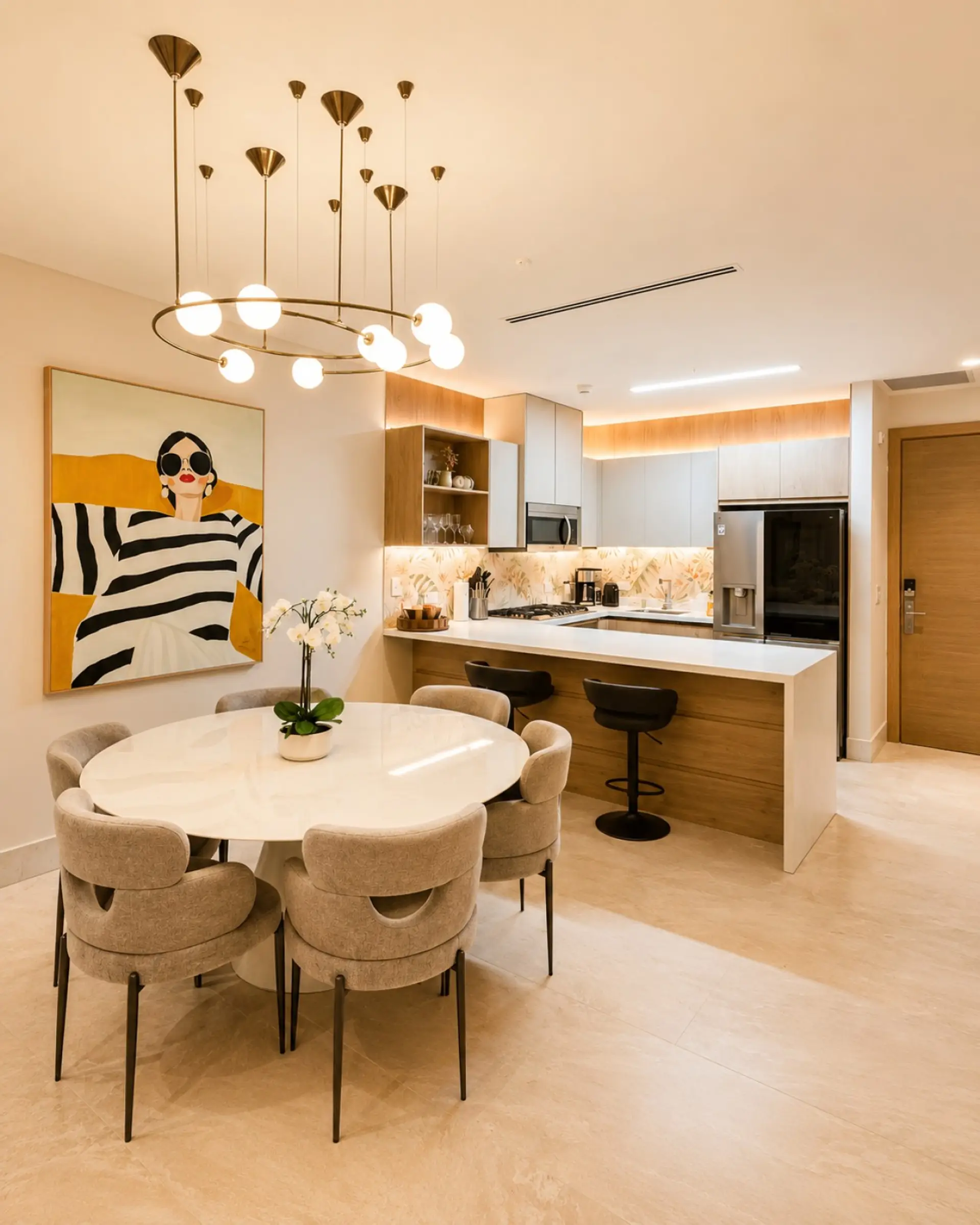 Modern open-concept kitchen and dining area featuring premium appliances, a spacious breakfast bar, and a dining table for six—perfect for cooking and enjoying meals together.
