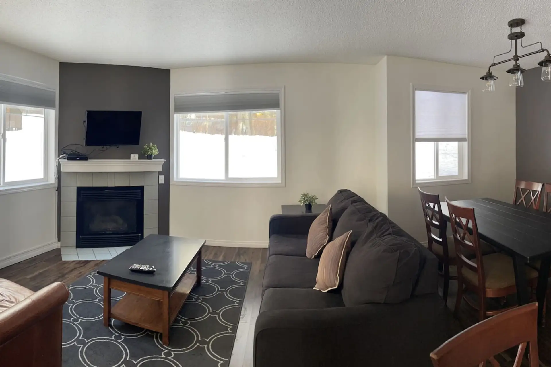 Open concept living room with fireplace. No sofa bed.