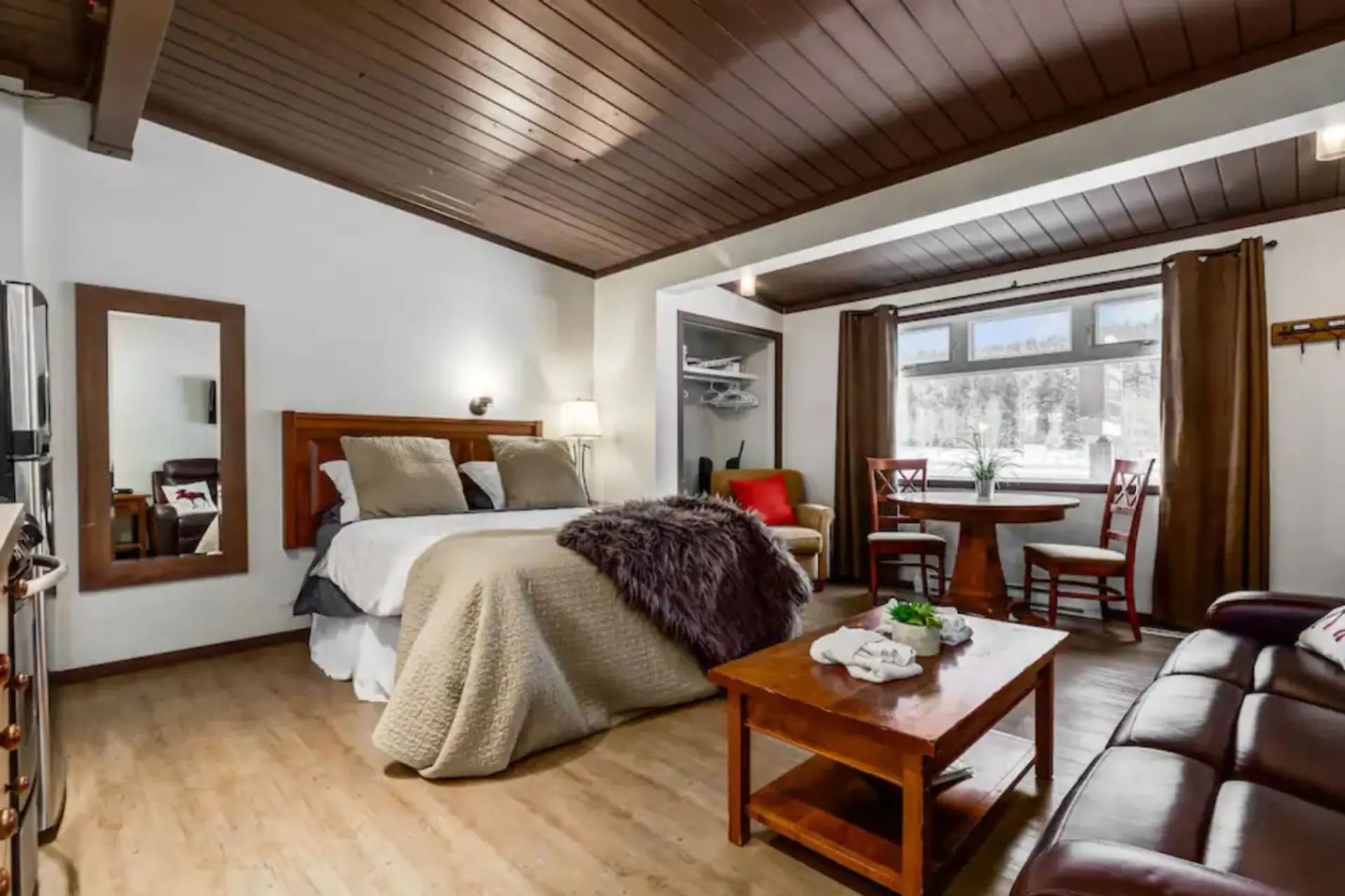 Open concept living room with Queen bed