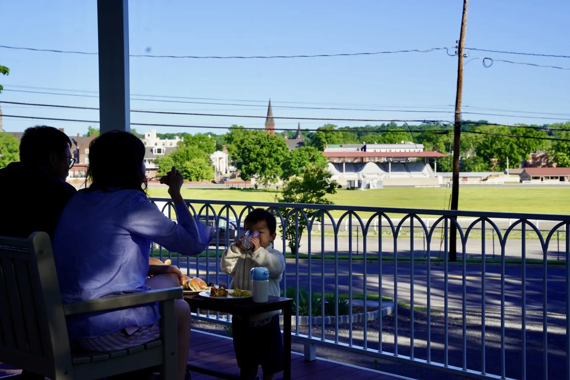 Breakfast on the porch at Parkway House Goshen comes with a front row view of the historic Goshen harness racing track, the oldest in America. Guests love starting the morning here watching the horses train just across the street.