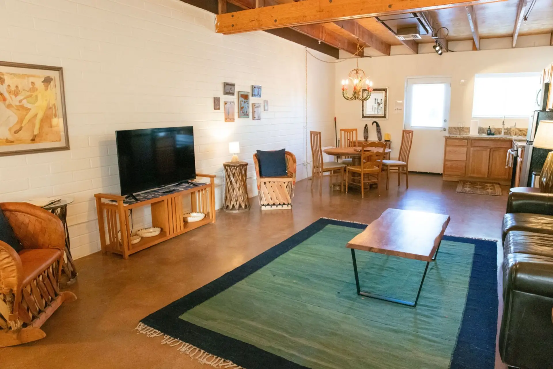 Living room, TV and dining area in the Ocotillo Casita