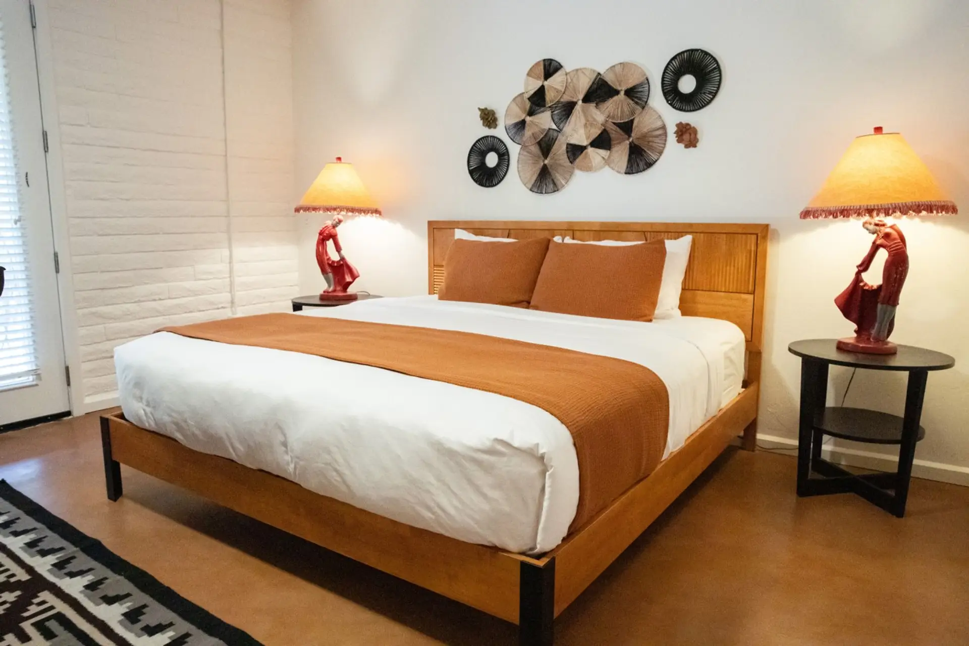 King bed with sculptural lamps in Diego's Room