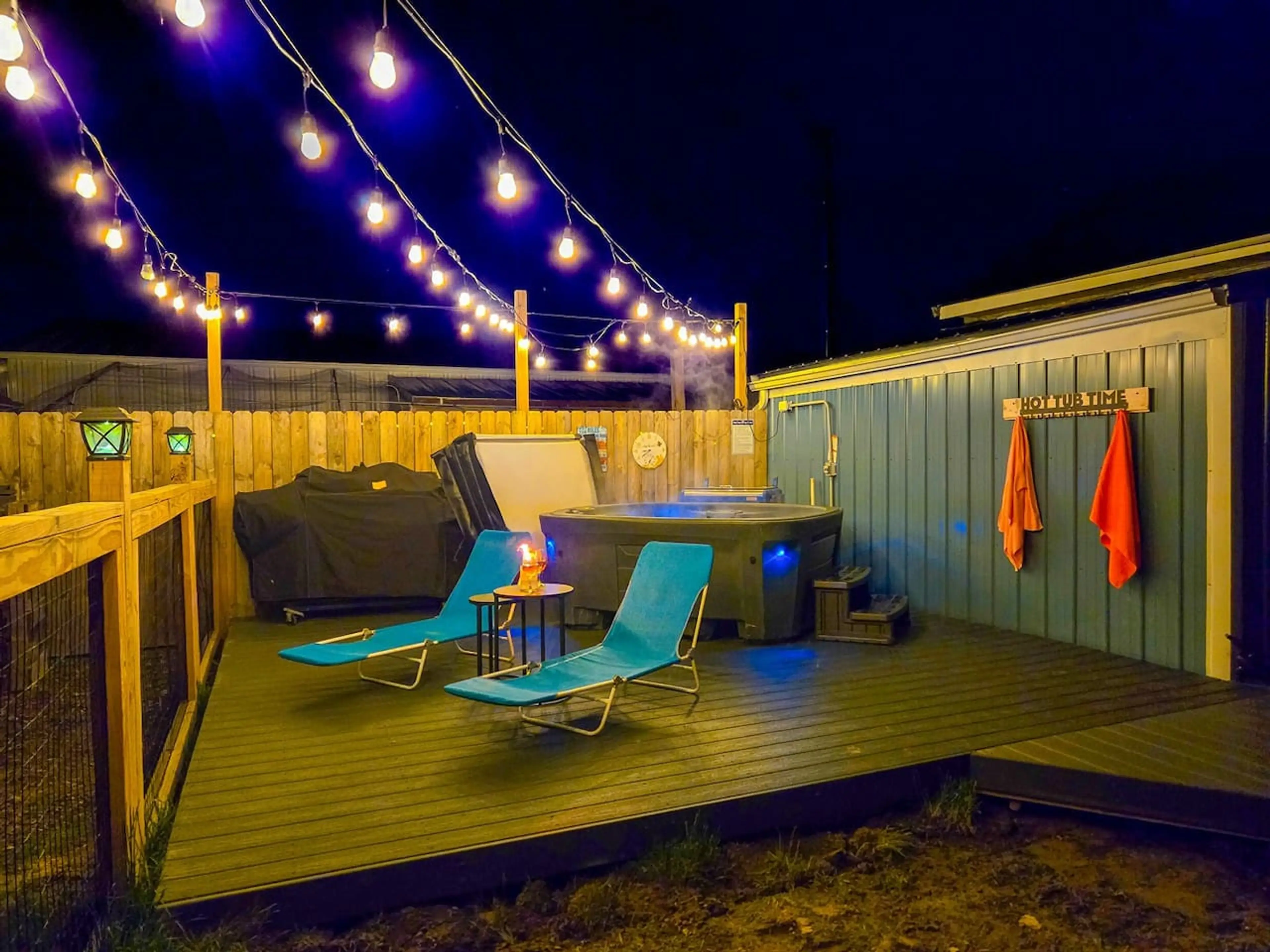 “Under the glow of string lights  Slip into the warm bubbles, breathe in the night air, and let the day melt away.”